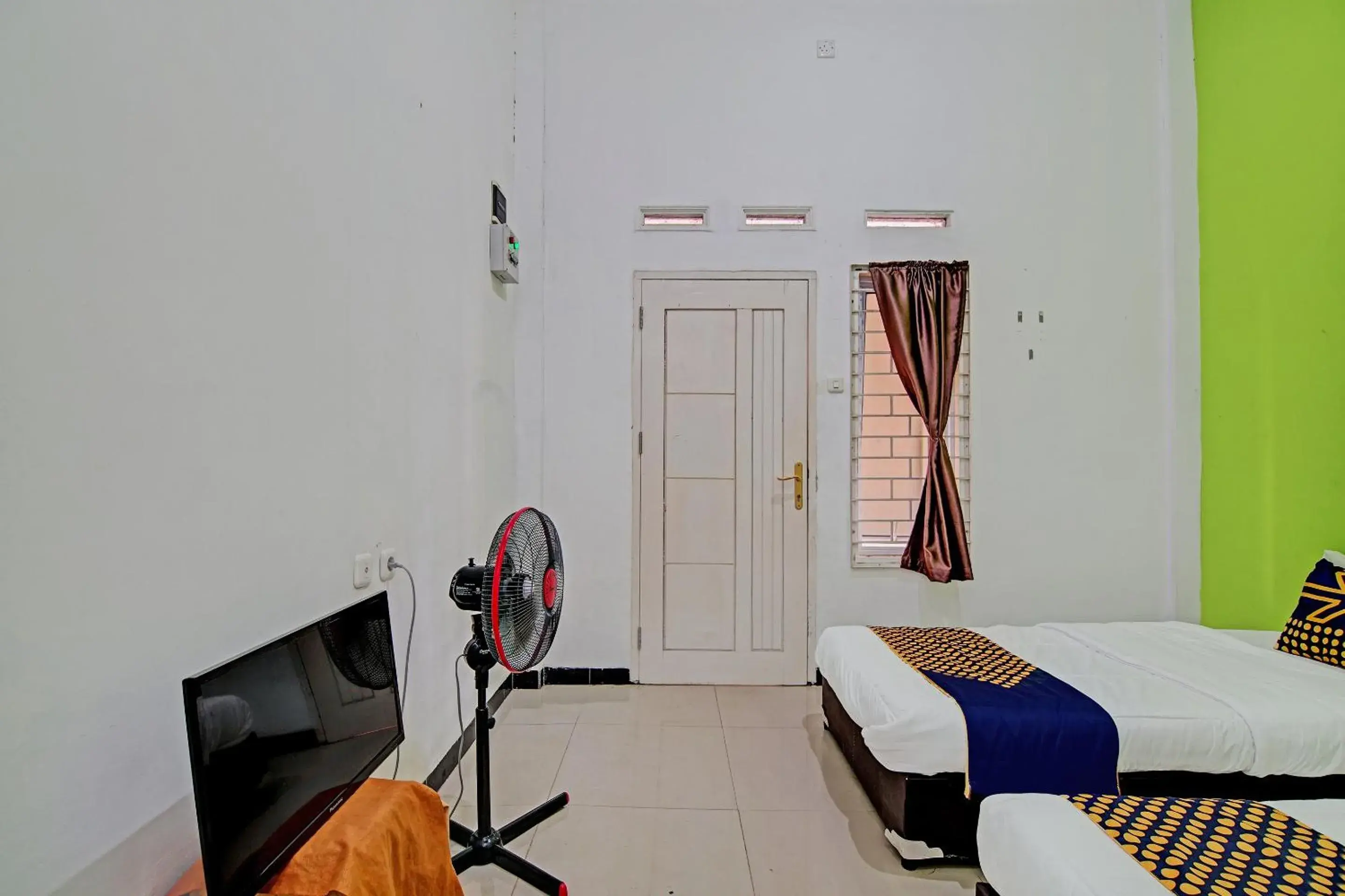 Bedroom, Bed in Hotel O Penginapan Puti SyariahNearBandara Sultan Syarif Kasim II Bedroom, Bed in Hotel O Penginapan Puti SyariahNearBandara Sultan Syarif Kasim II