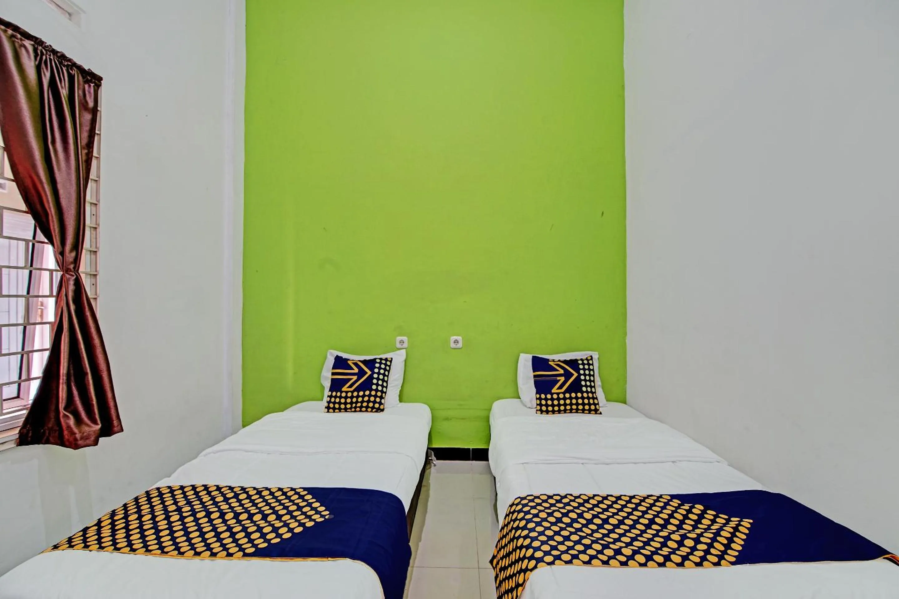 Bedroom, Bed in Hotel O Penginapan Puti SyariahNearBandara Sultan Syarif Kasim II