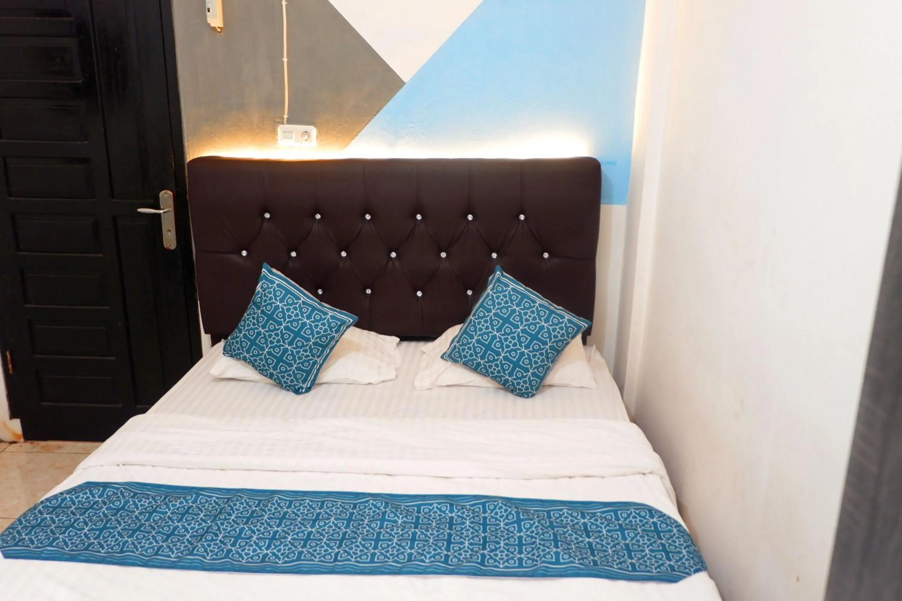 Bed in Kasmarani Homestay