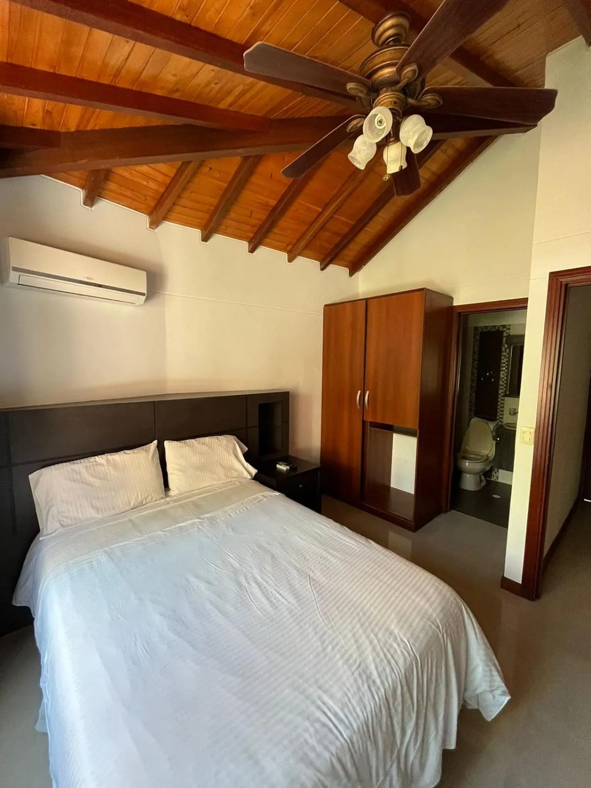 Bed in Serenity Suites Casa Boutique