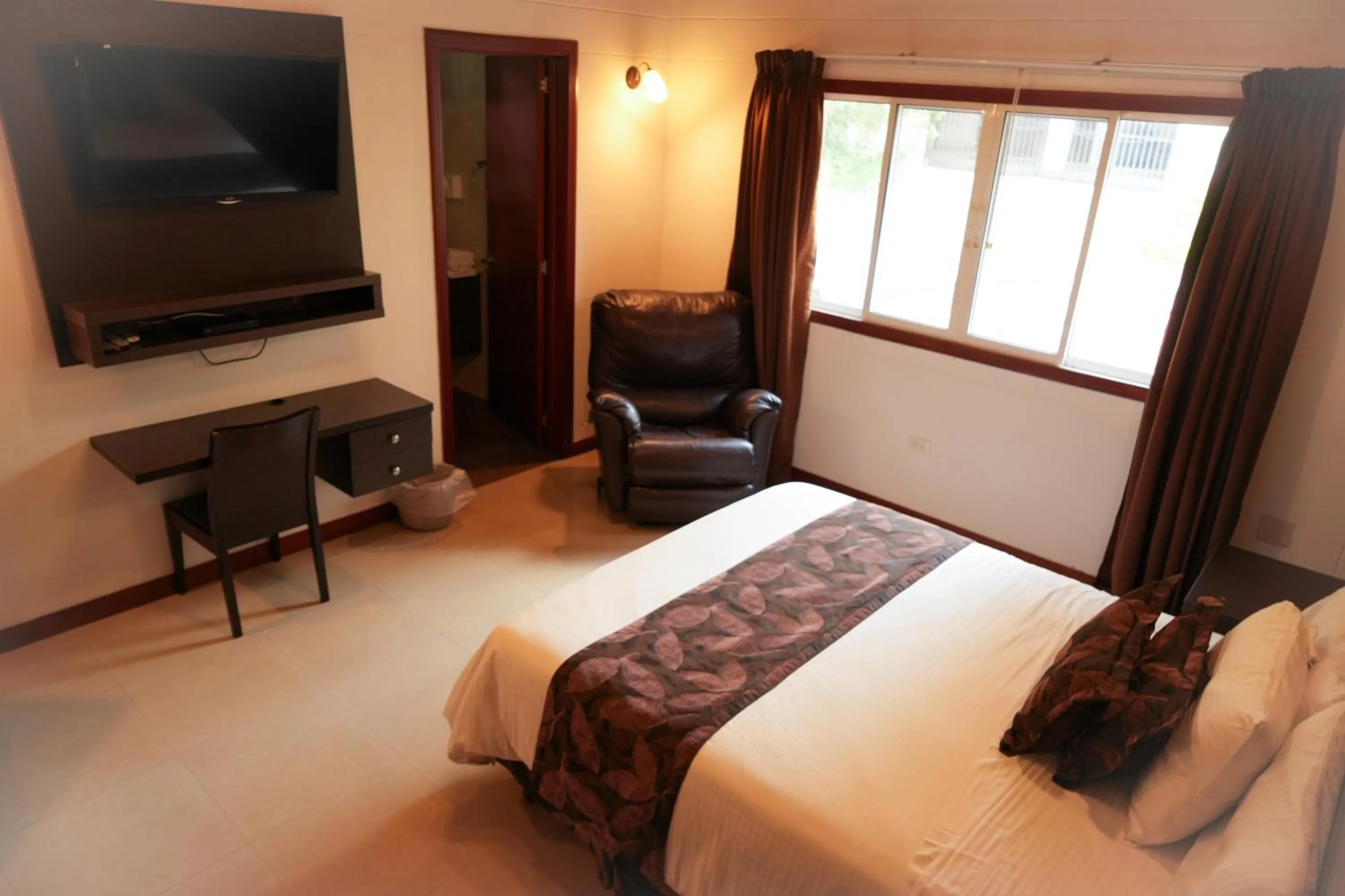 Bed in Serenity Suites Casa Boutique