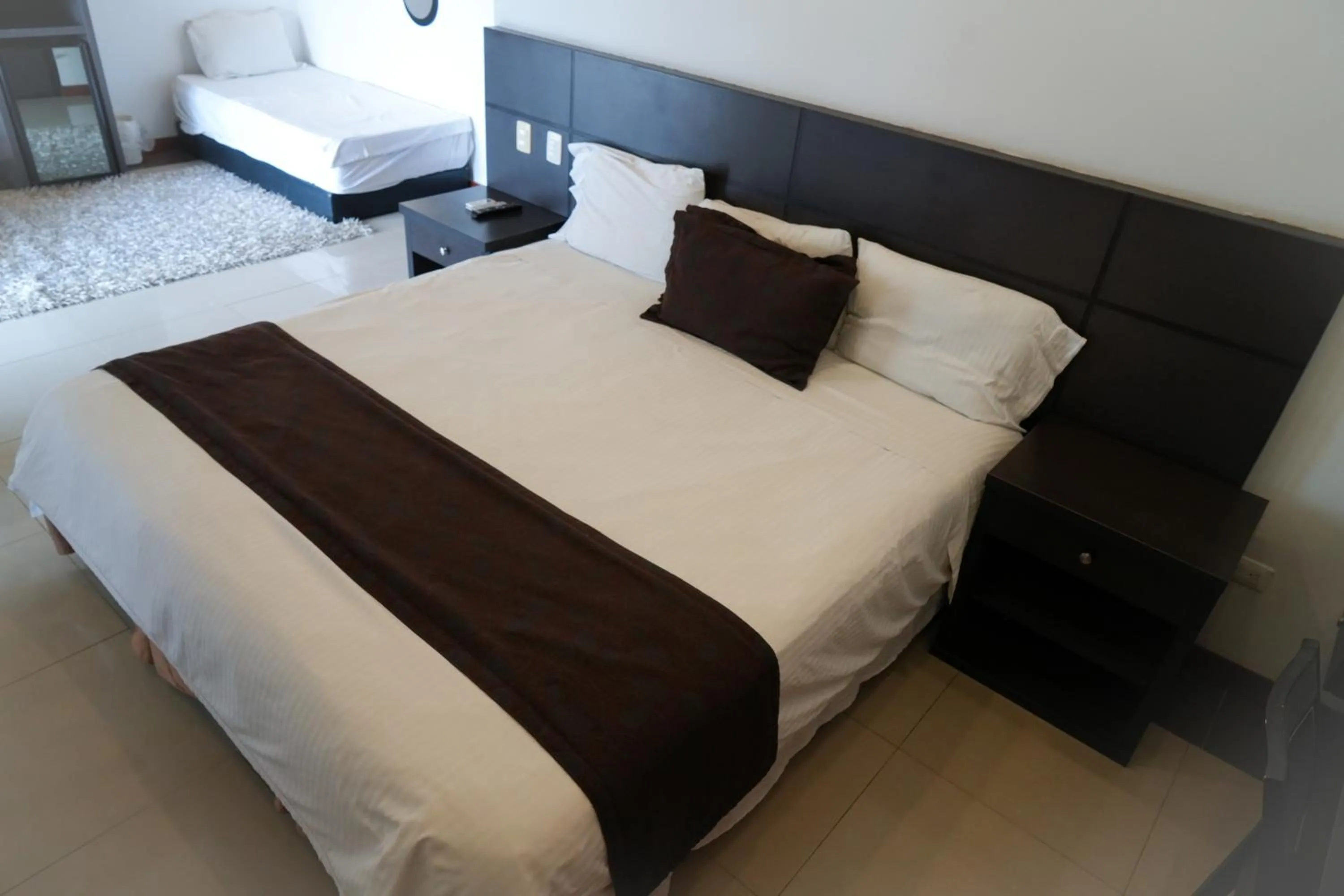 Bed in Serenity Suites Casa Boutique