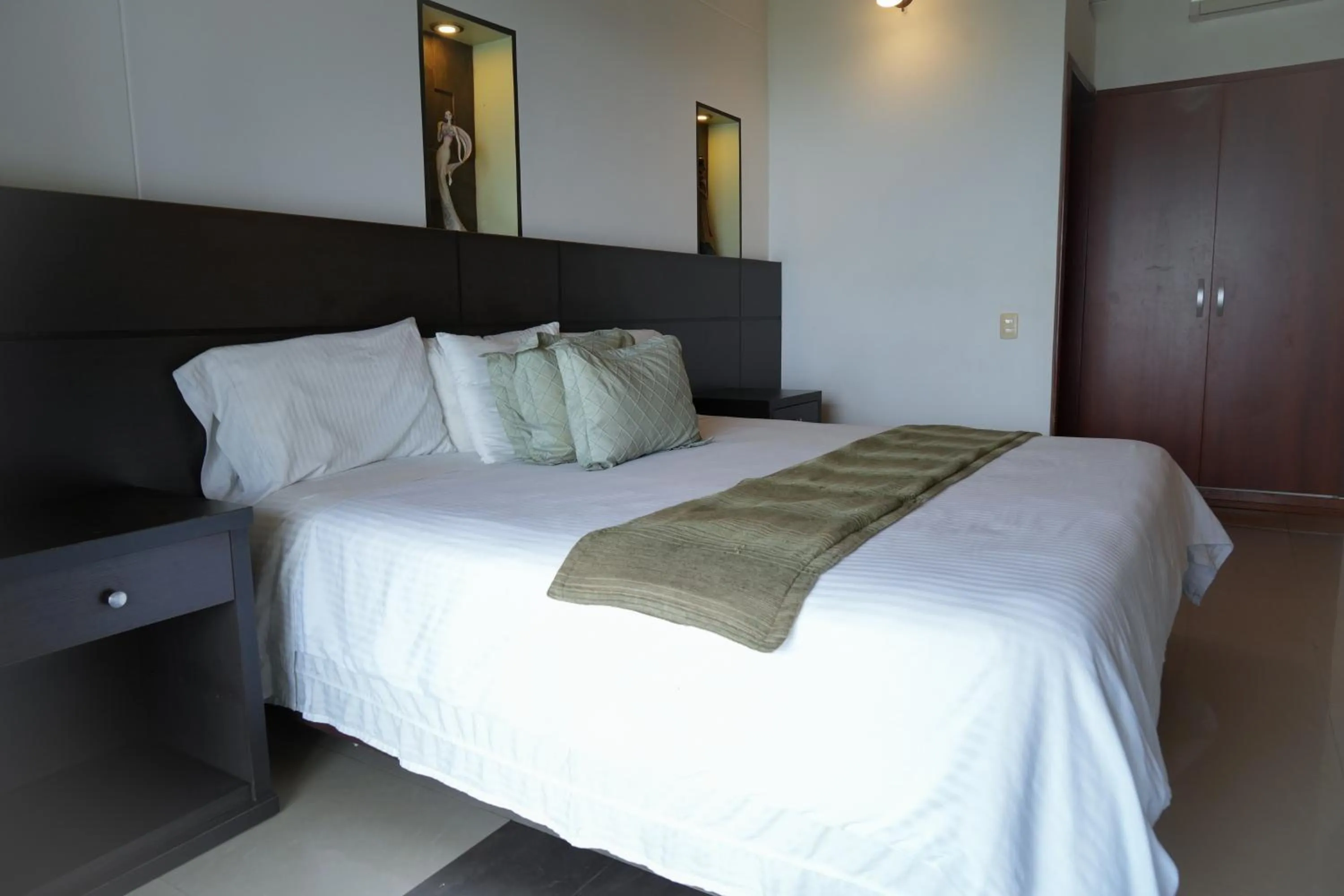 Bed in Serenity Suites Casa Boutique