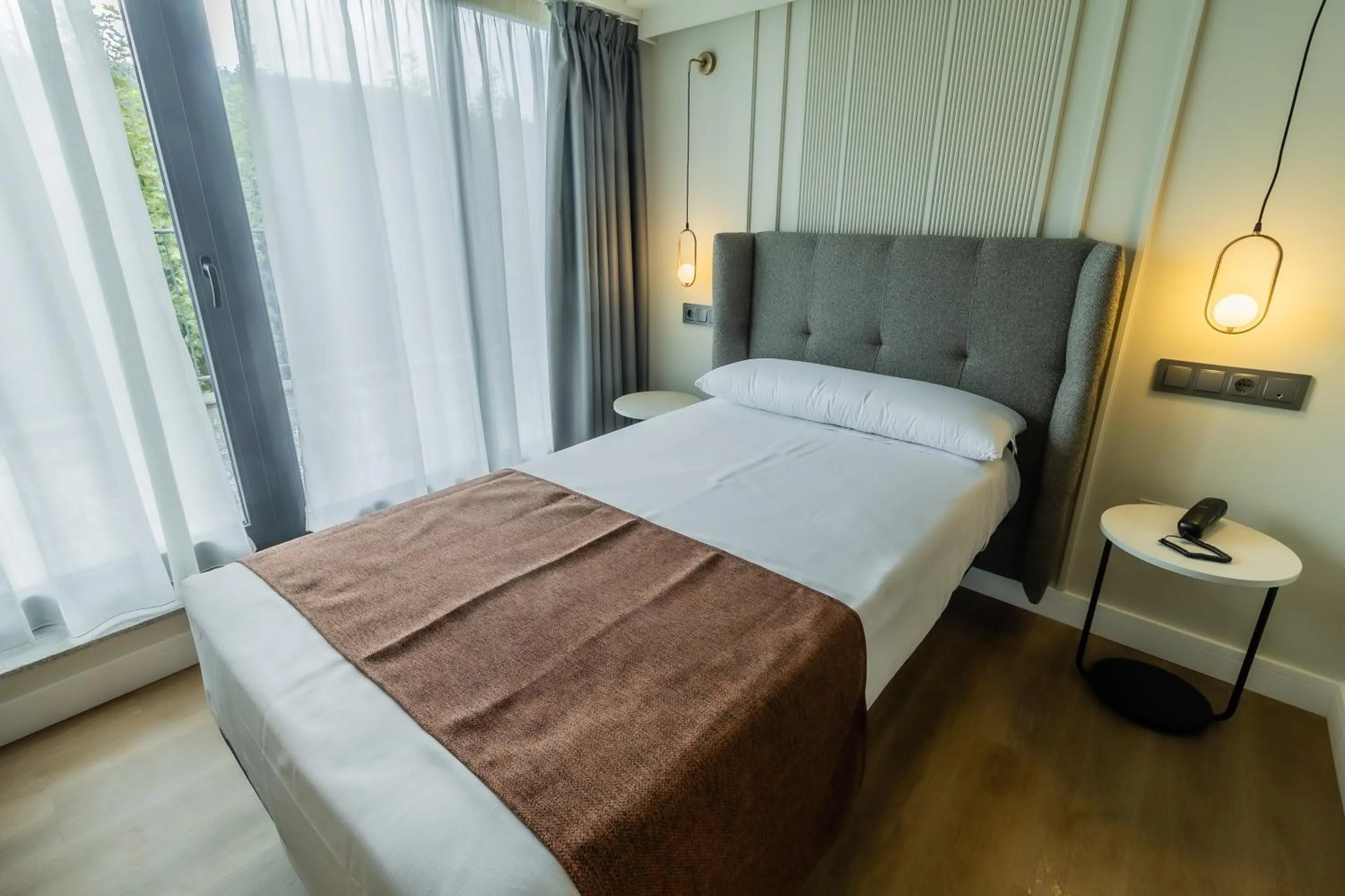 Bed in HOTEL CORONA DE PADRÓN