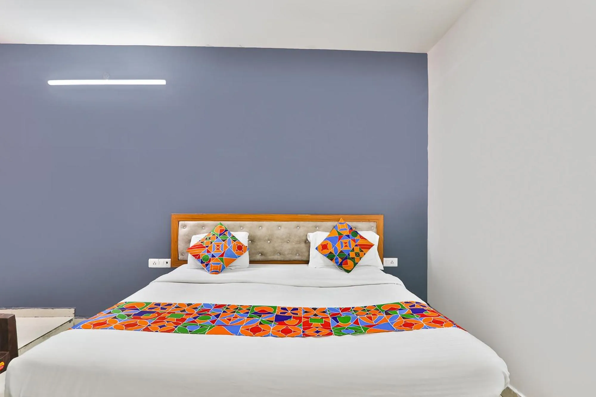 Bed in FabHotel Raas Inn