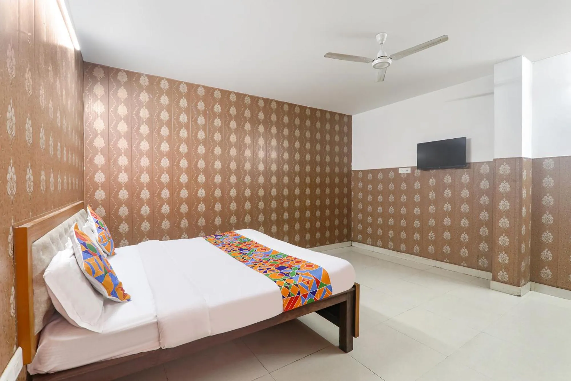 Bed in FabHotel Raas Inn