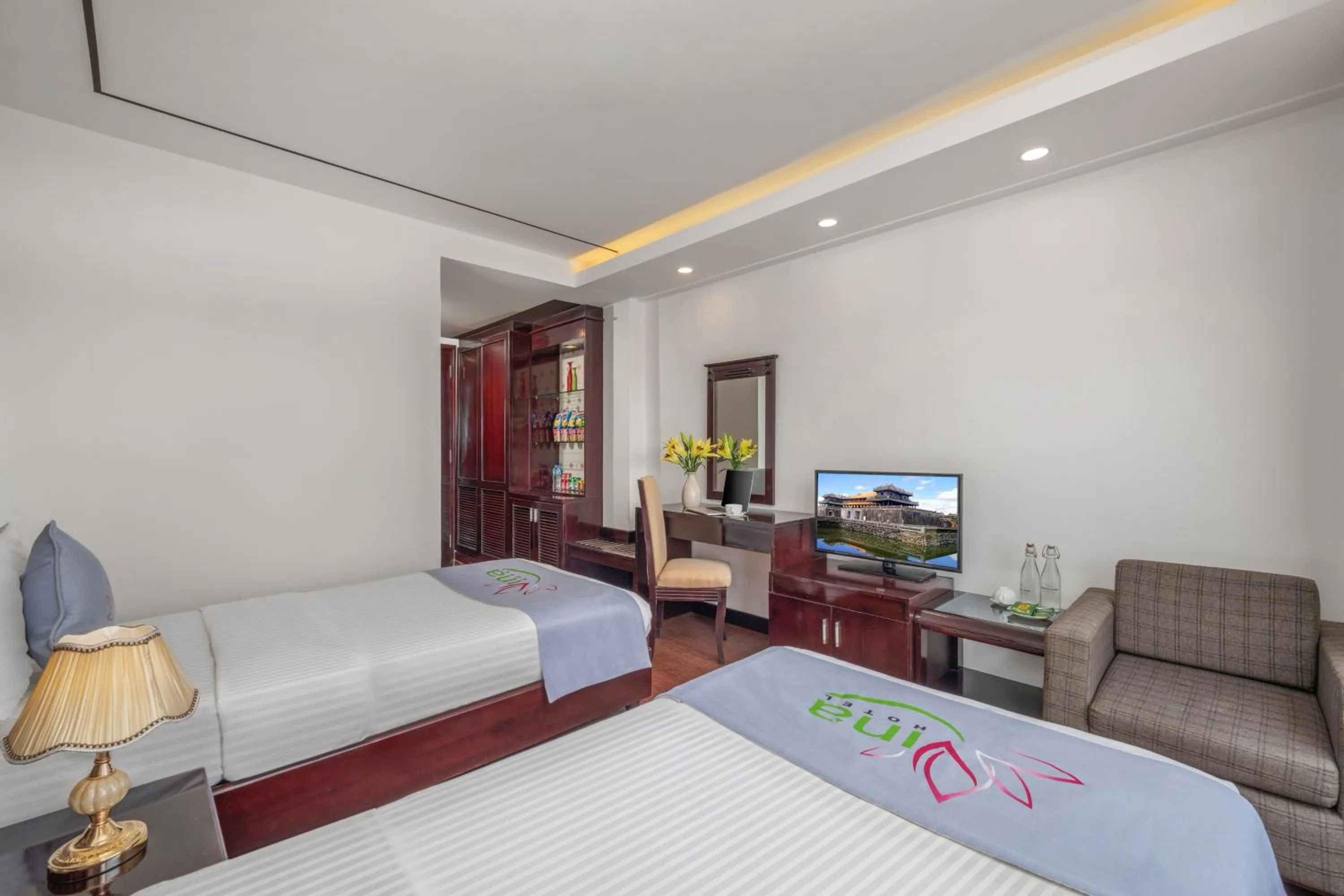 Communal lounge/ TV room, Bed in Vina Hotel Hue