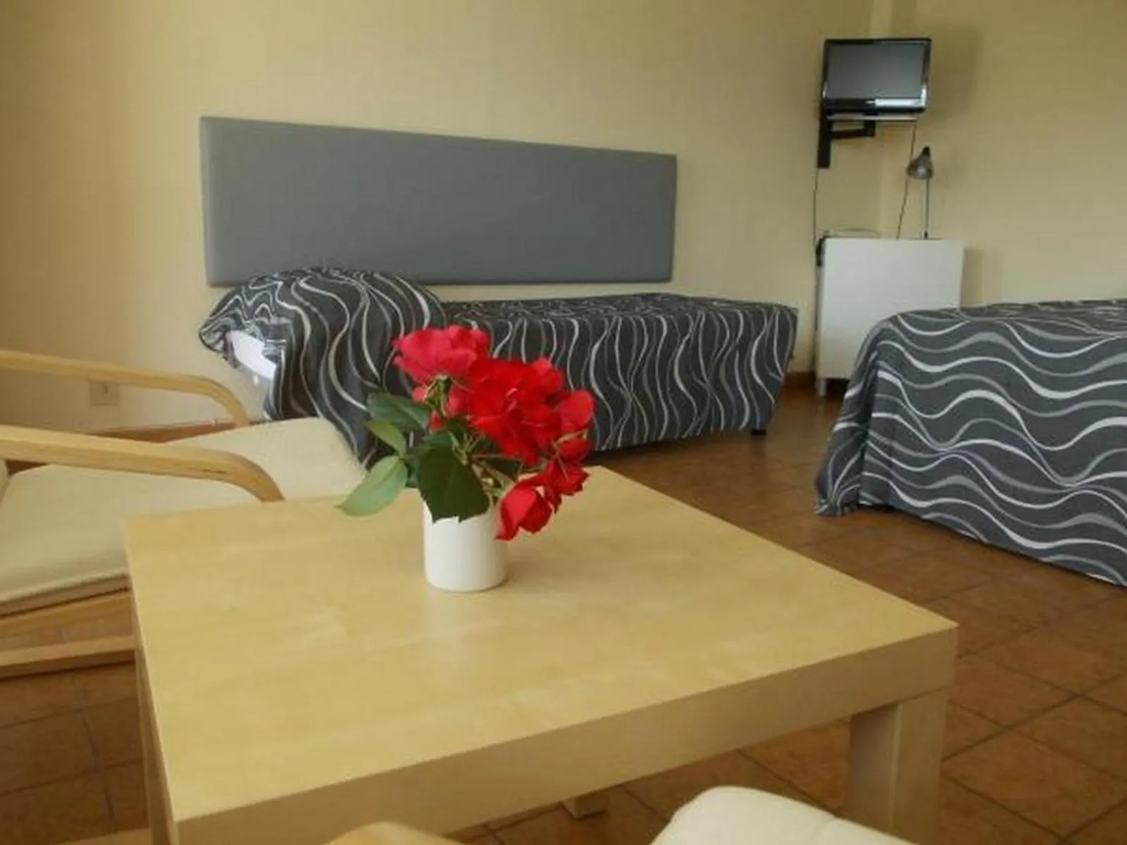 Living room, Bed in Residence La Carruba