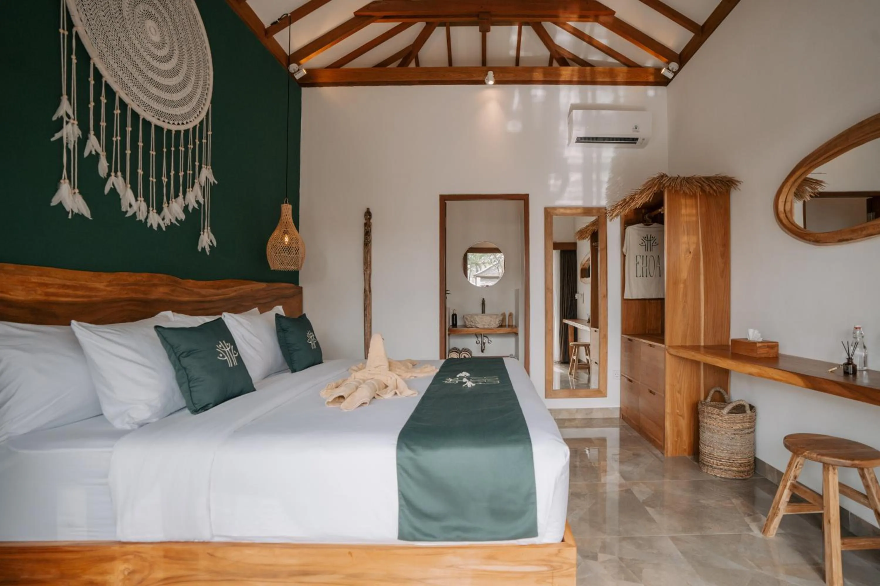 Bed in EHOA NYANYI BEACH Boutique Hotel - In front of entrance to NUANU