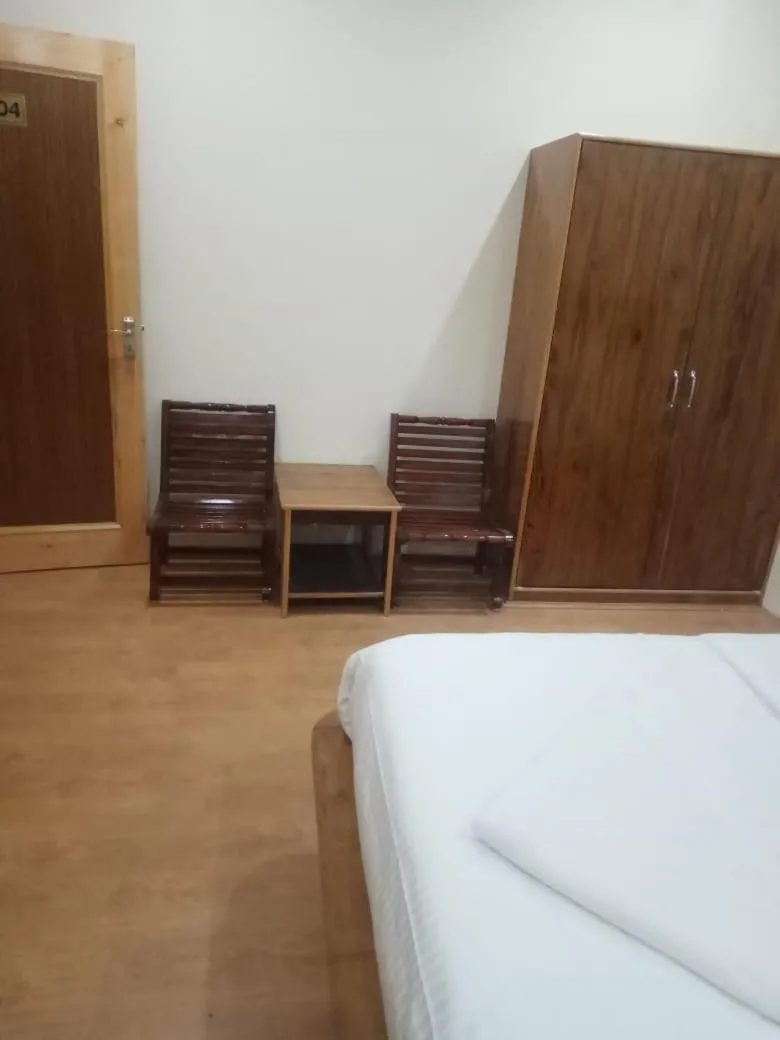 Seating area, Bed in Green View Guest House
