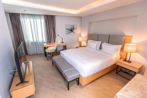 Bed in The Row Residential Hotel