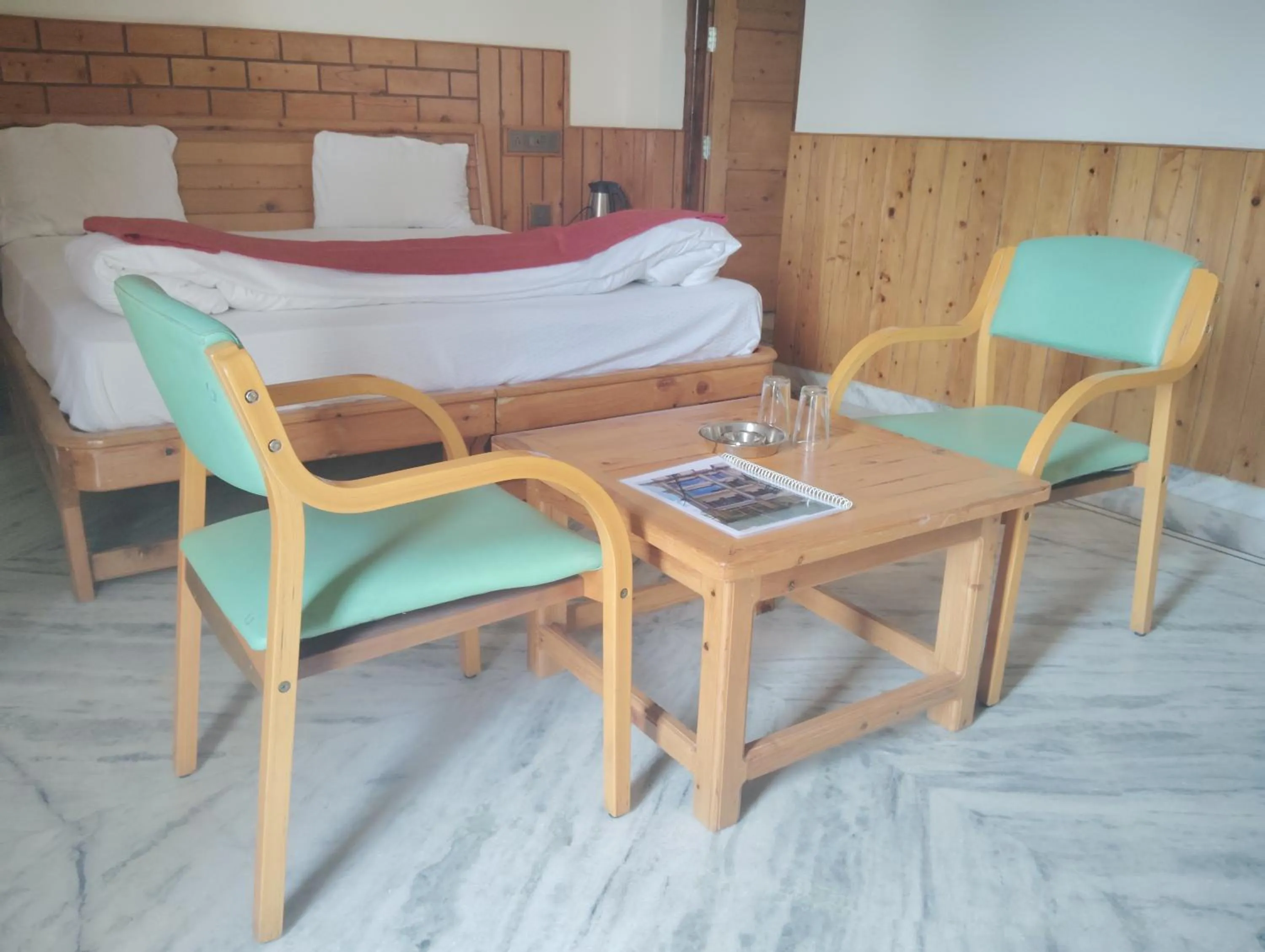 Dining area, Bed in Hotel CM Palace - Pure Vegetarian