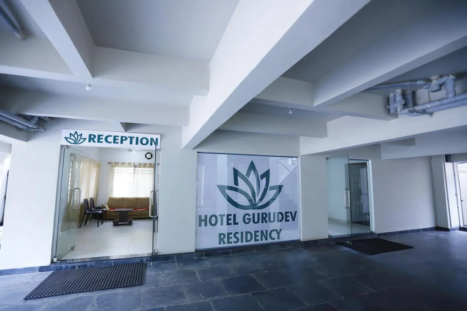 Property logo or sign in Hotel Gurudev Residency