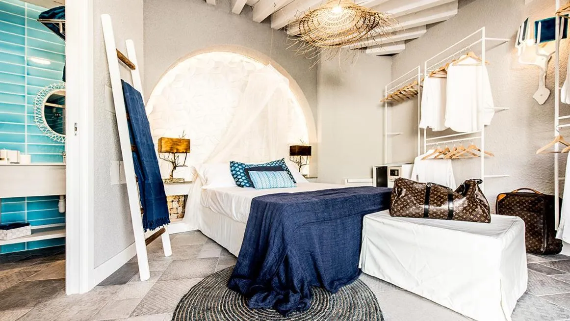 Bed in CapoBlu Hotel