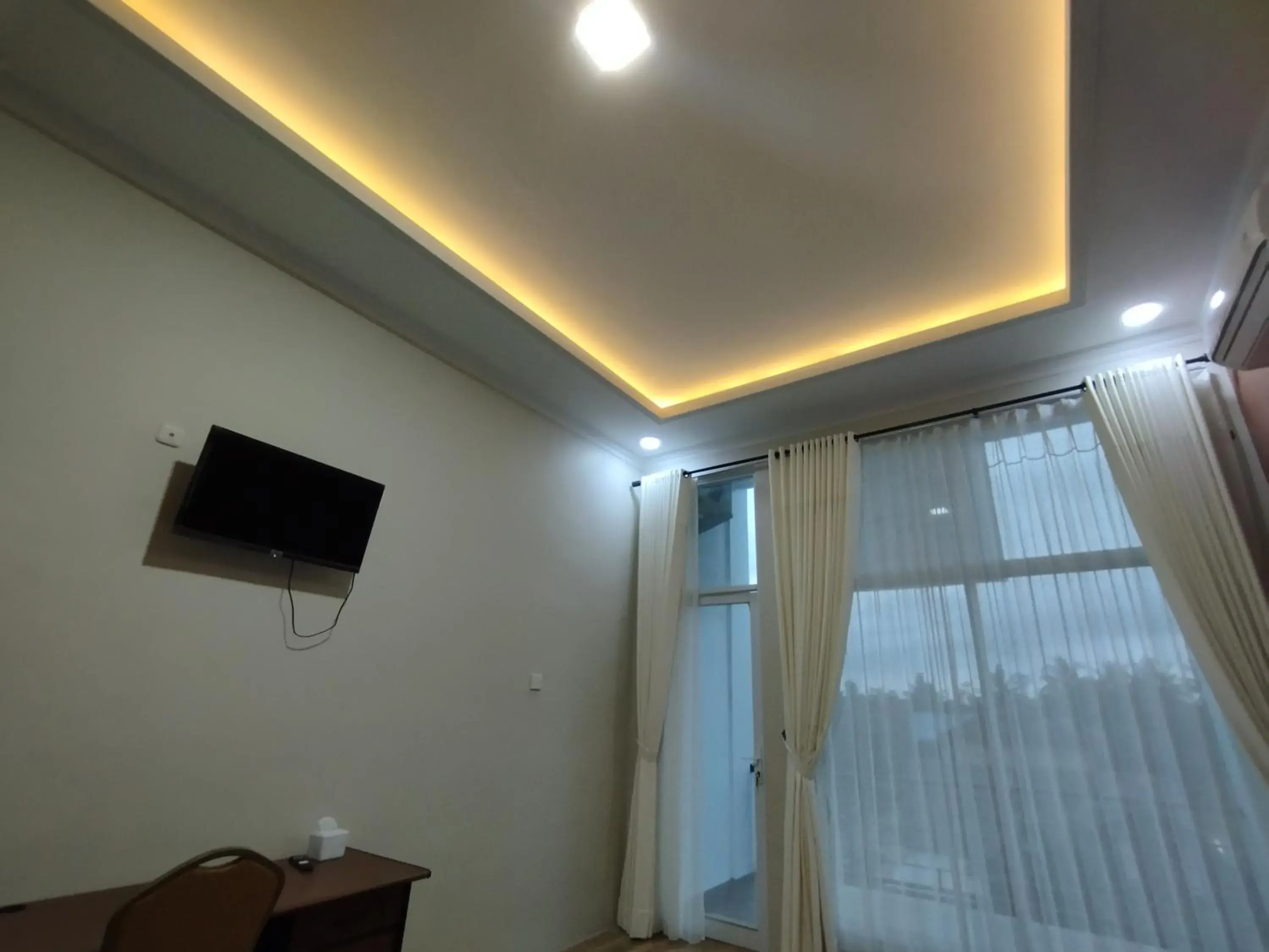 Communal lounge/ TV room in Saira Hotel dan Homestay Syariah Communal lounge/ TV room in Saira Hotel dan Homestay Syariah