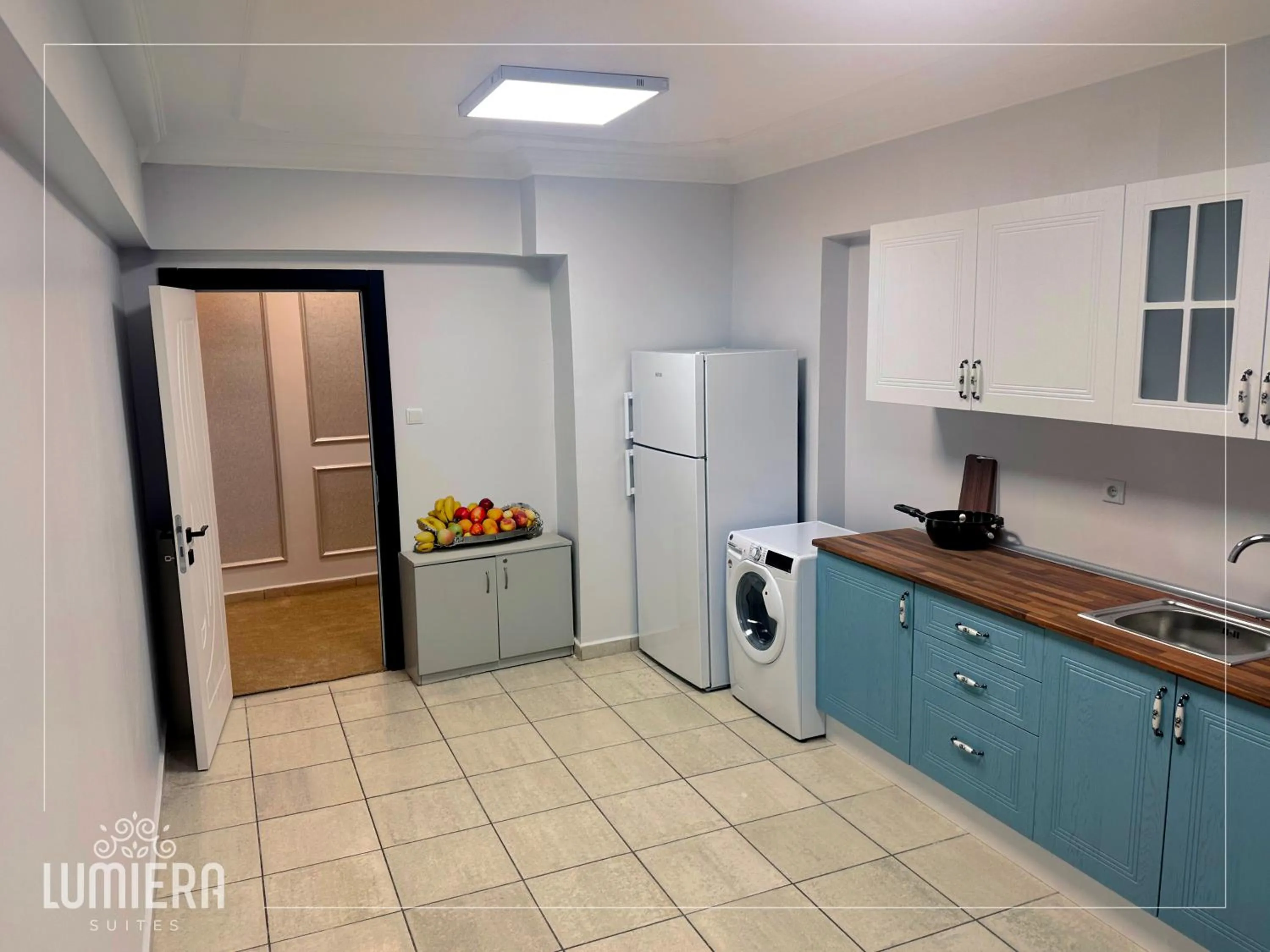 Kitchen or kitchenette in Lumiera Suites Hotel