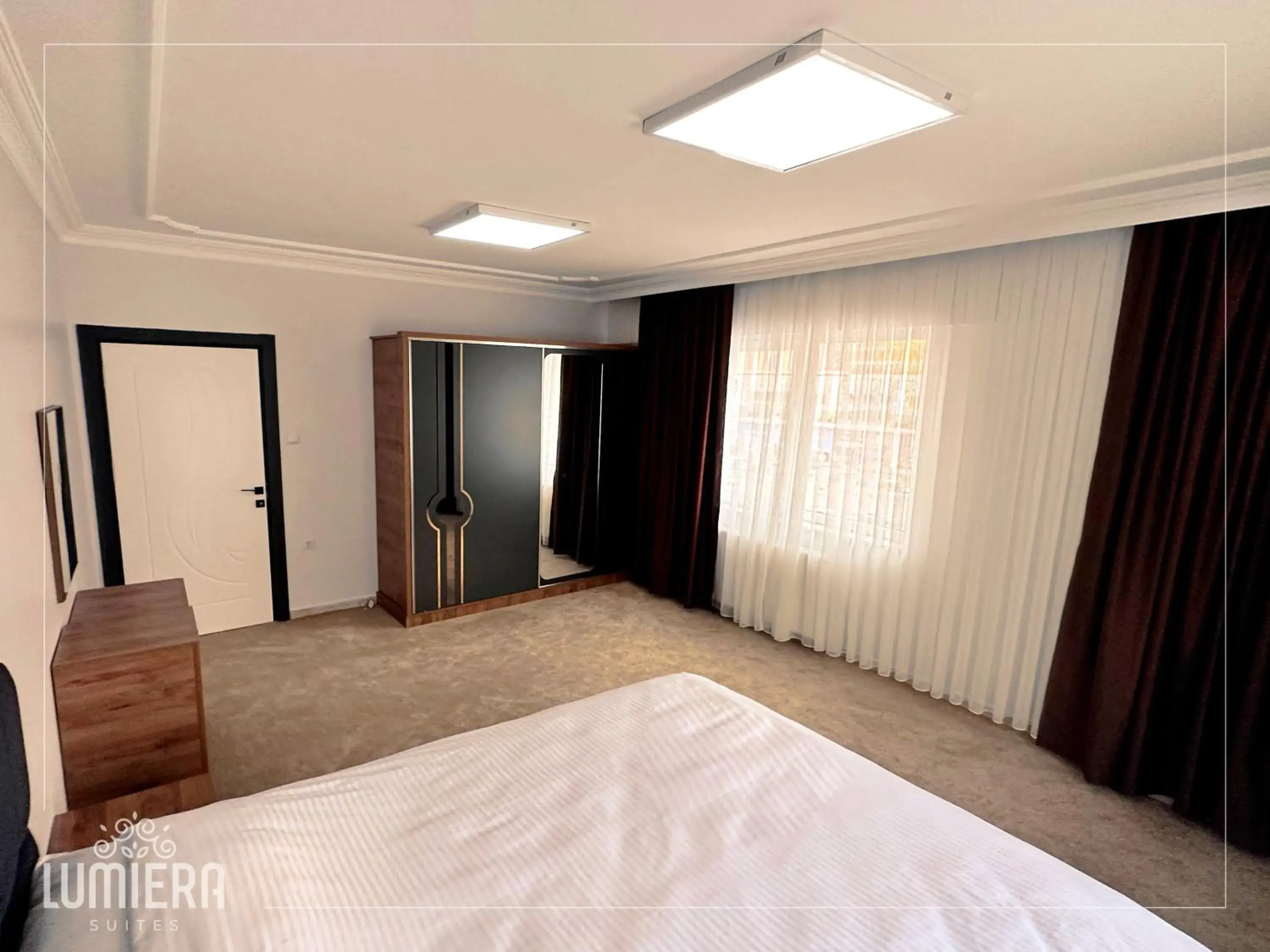 Photo of the whole room, Bed in Lumiera Suites Hotel Photo of the whole room, Bed in Lumiera Suites Hotel