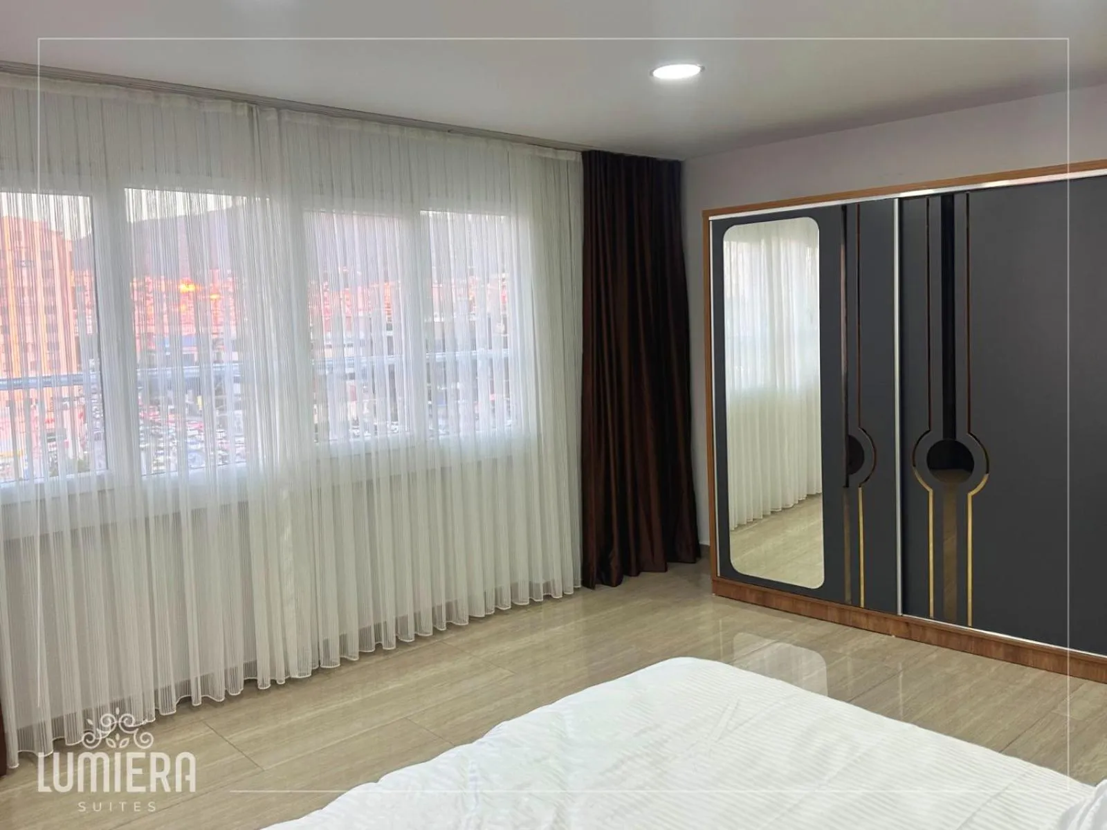 Bed in Lumiera Suites Hotel