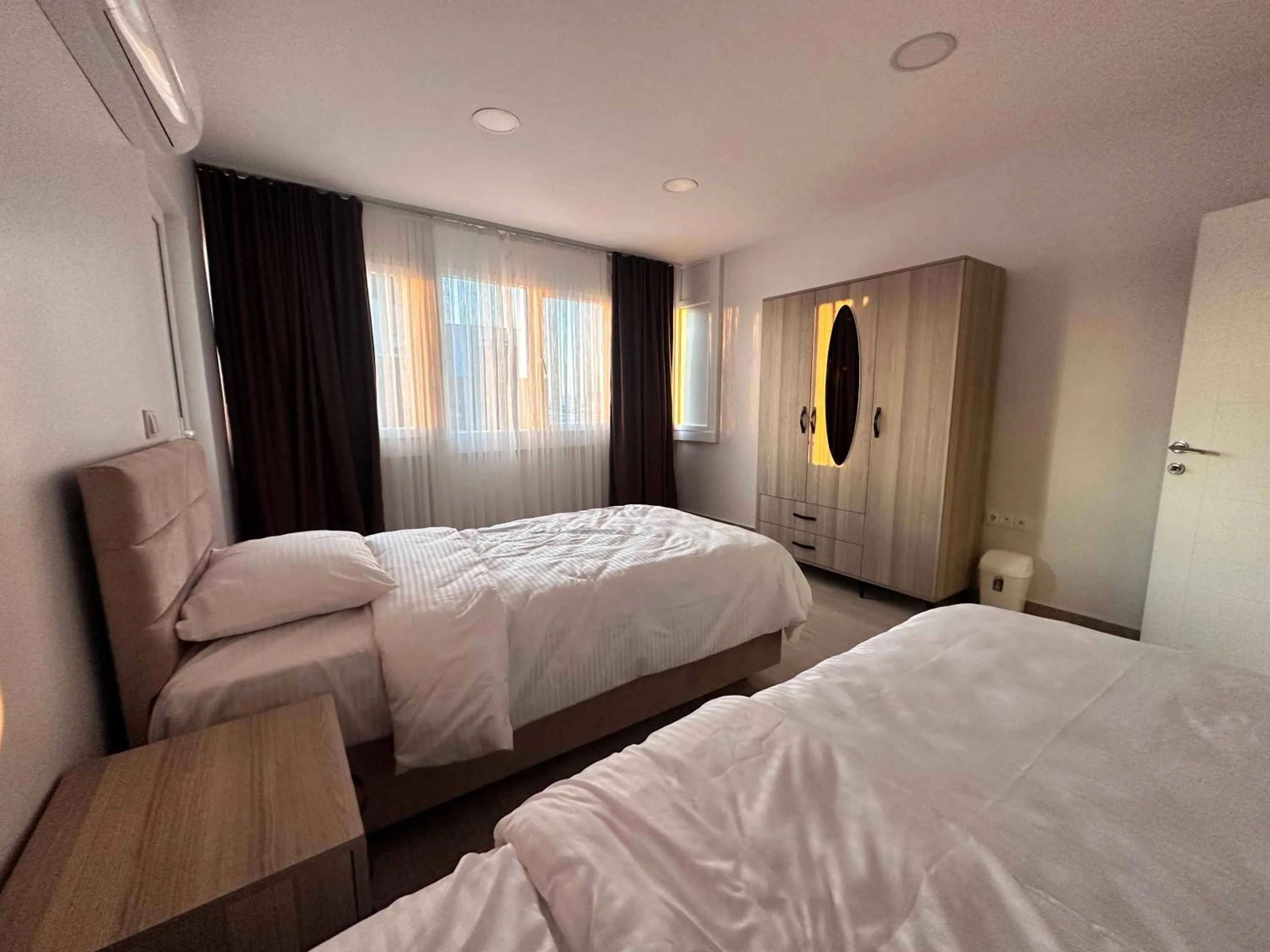 Bed in Lumiera Suites Hotel