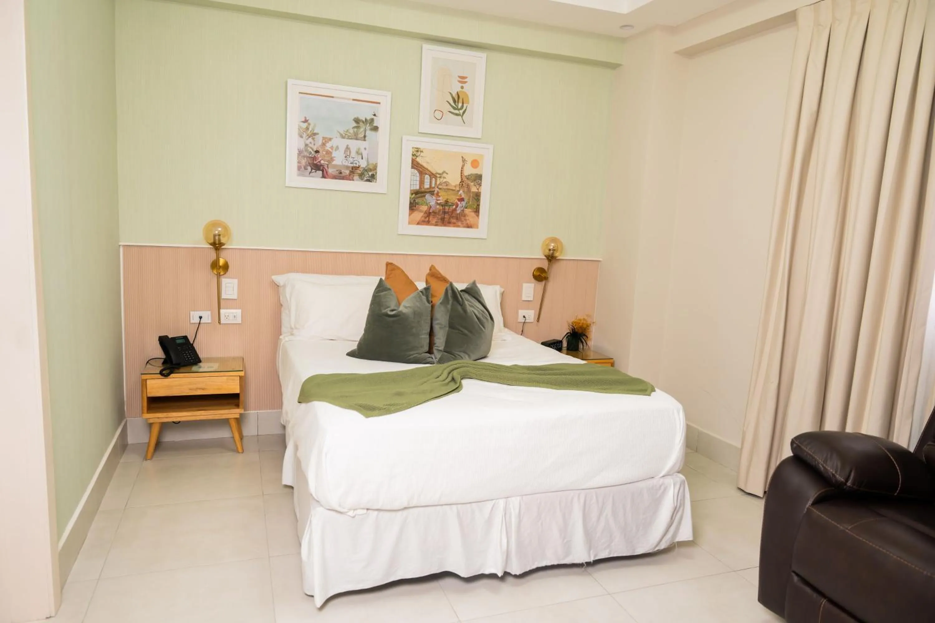 Bed in Hotel Stay Here Suites