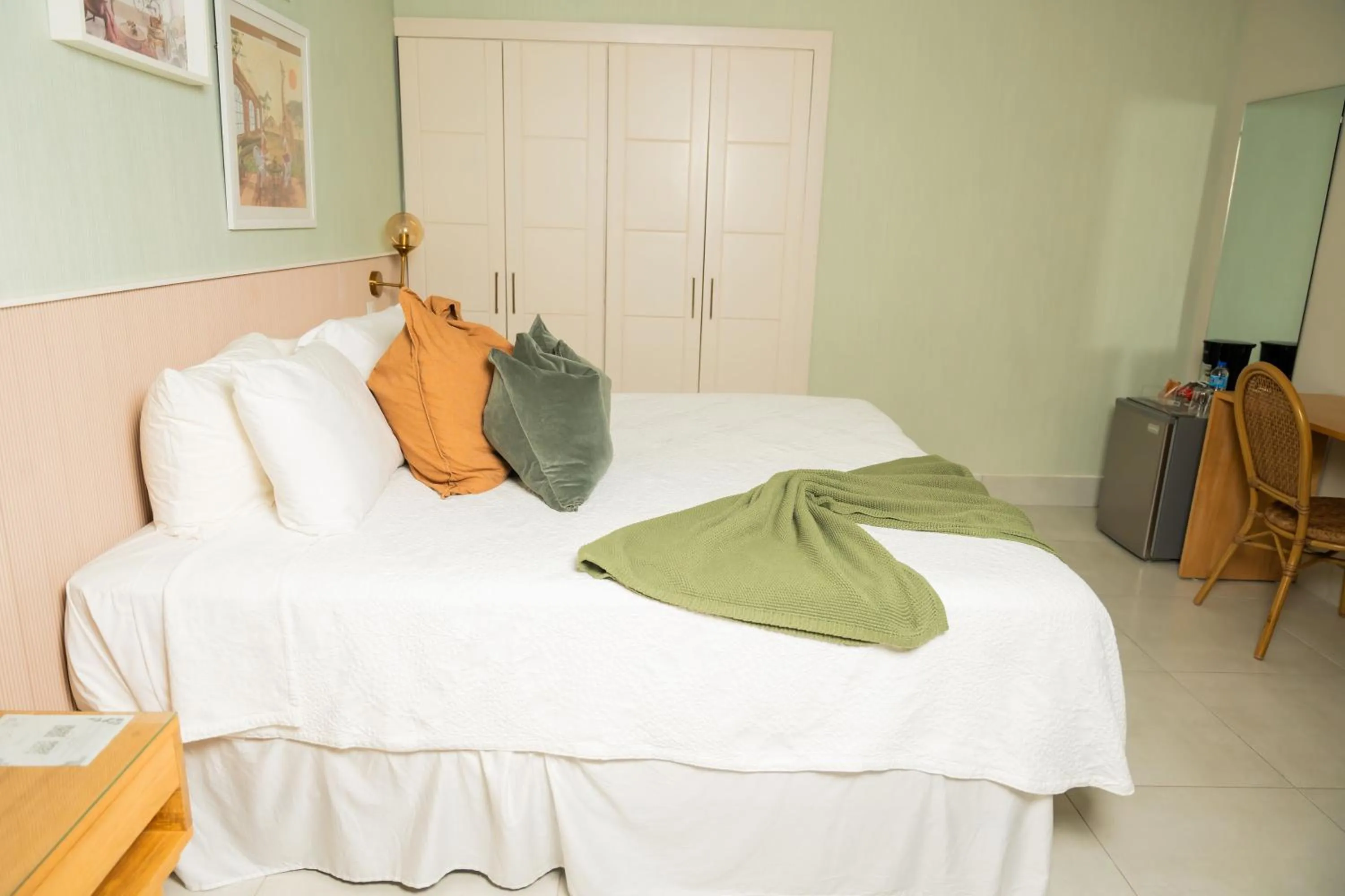 Bed in Hotel Stay Here Suites