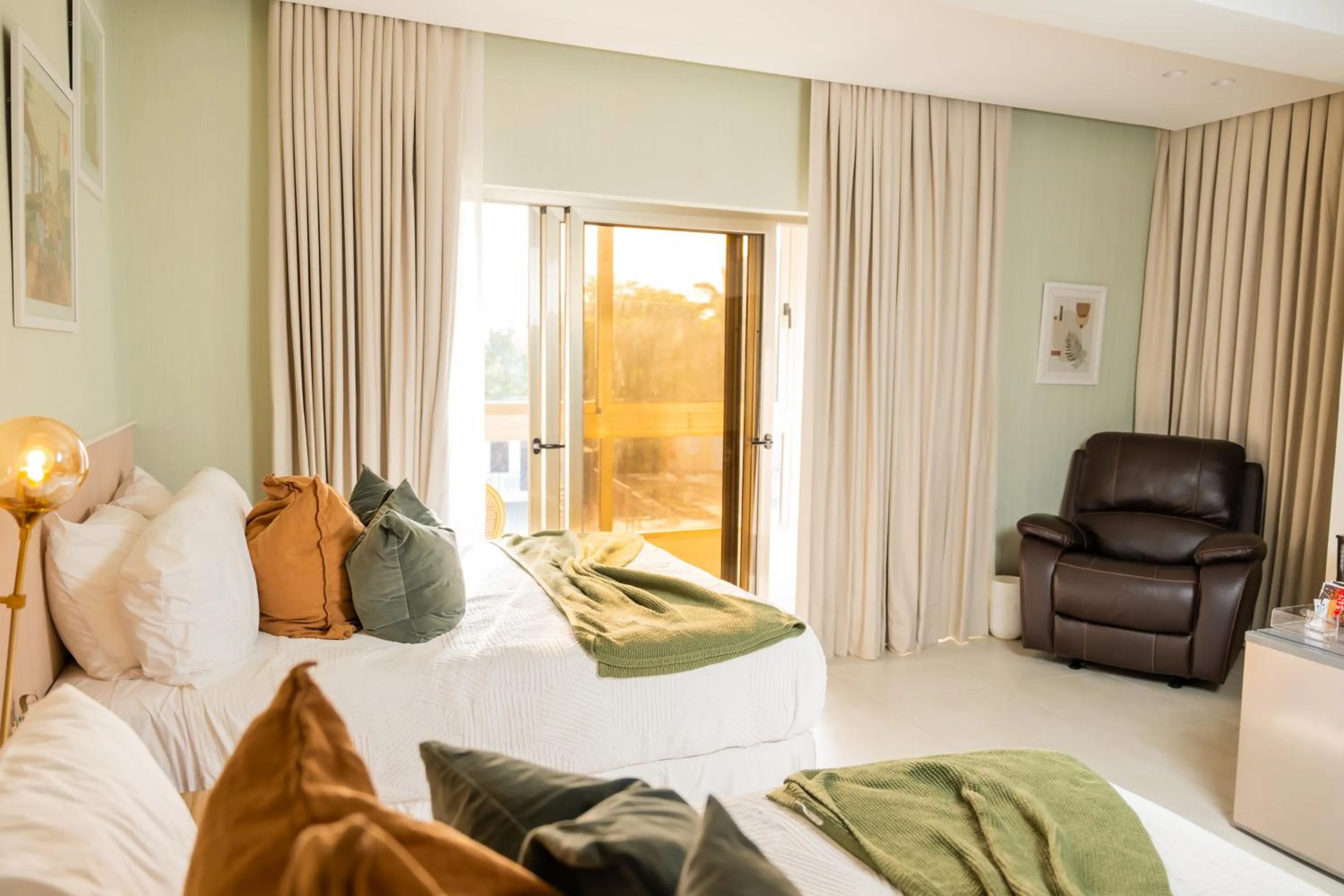 Bed in Hotel Stay Here Suites