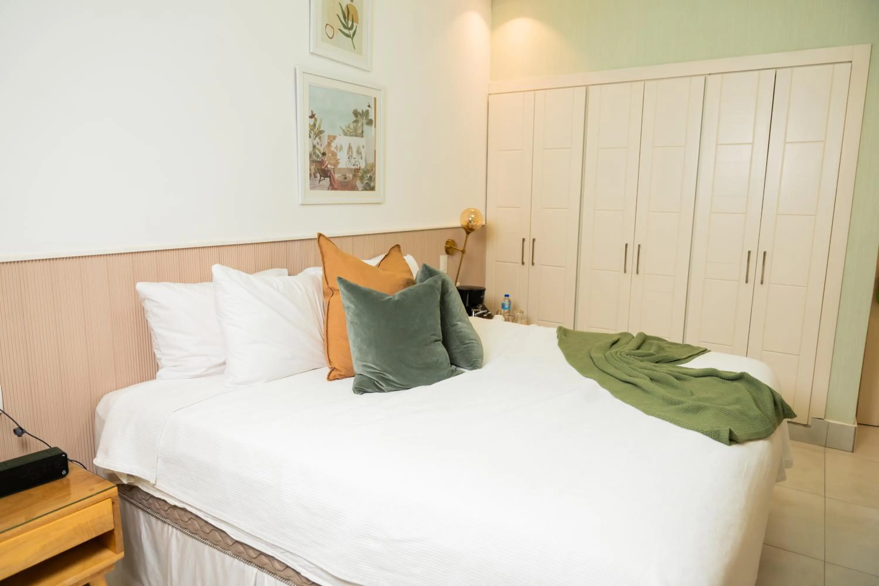 Bed in Hotel Stay Here Suites