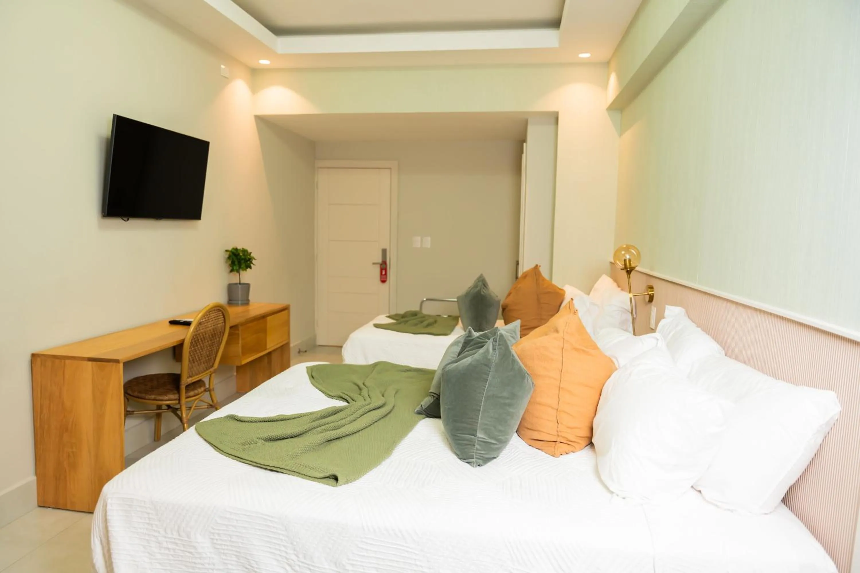 Bed in Hotel Stay Here Suites