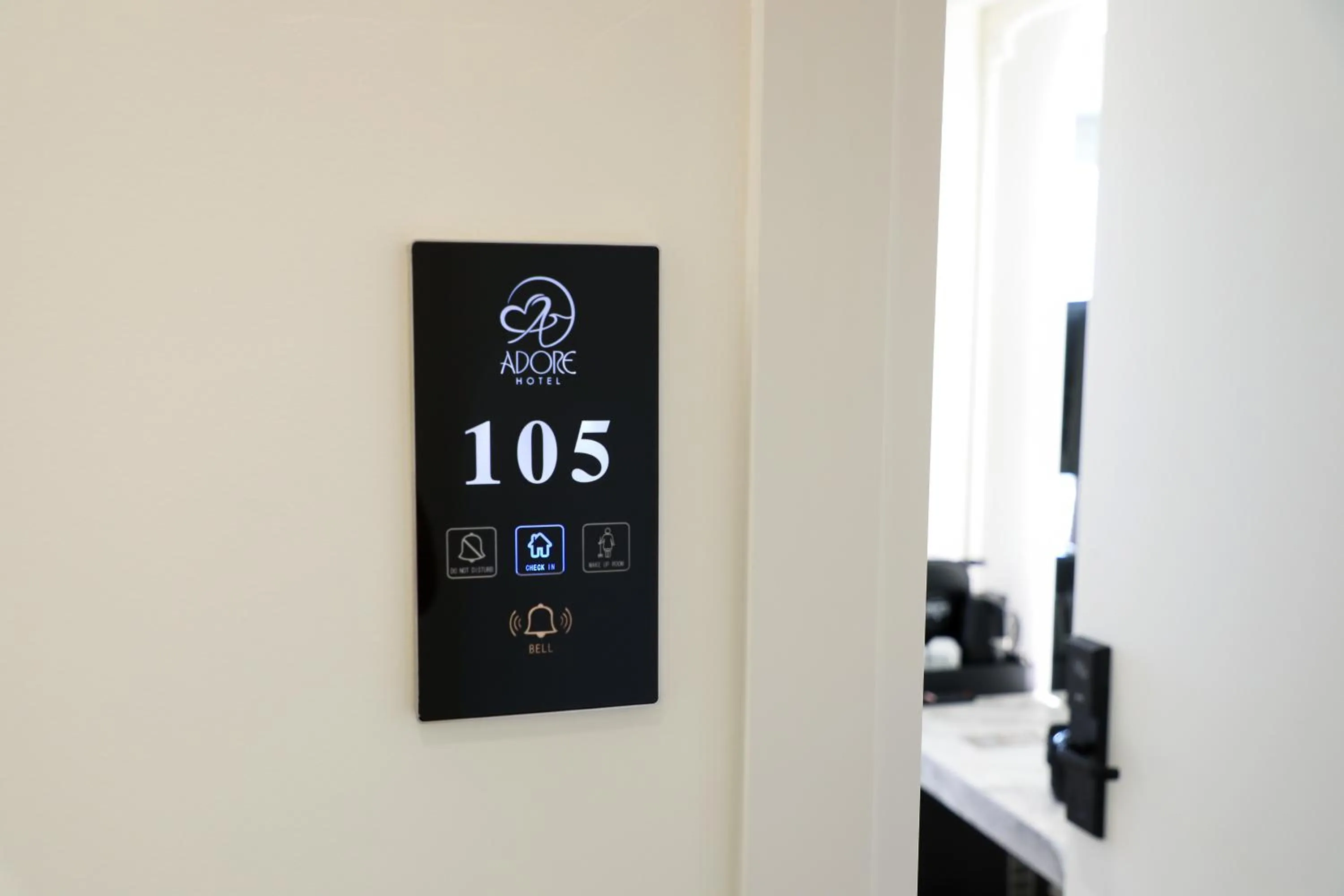 Property logo or sign in Hotel Adore