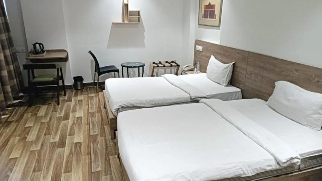 Bedroom, Bed in Sapphero Akshar Inn- Jamnagar