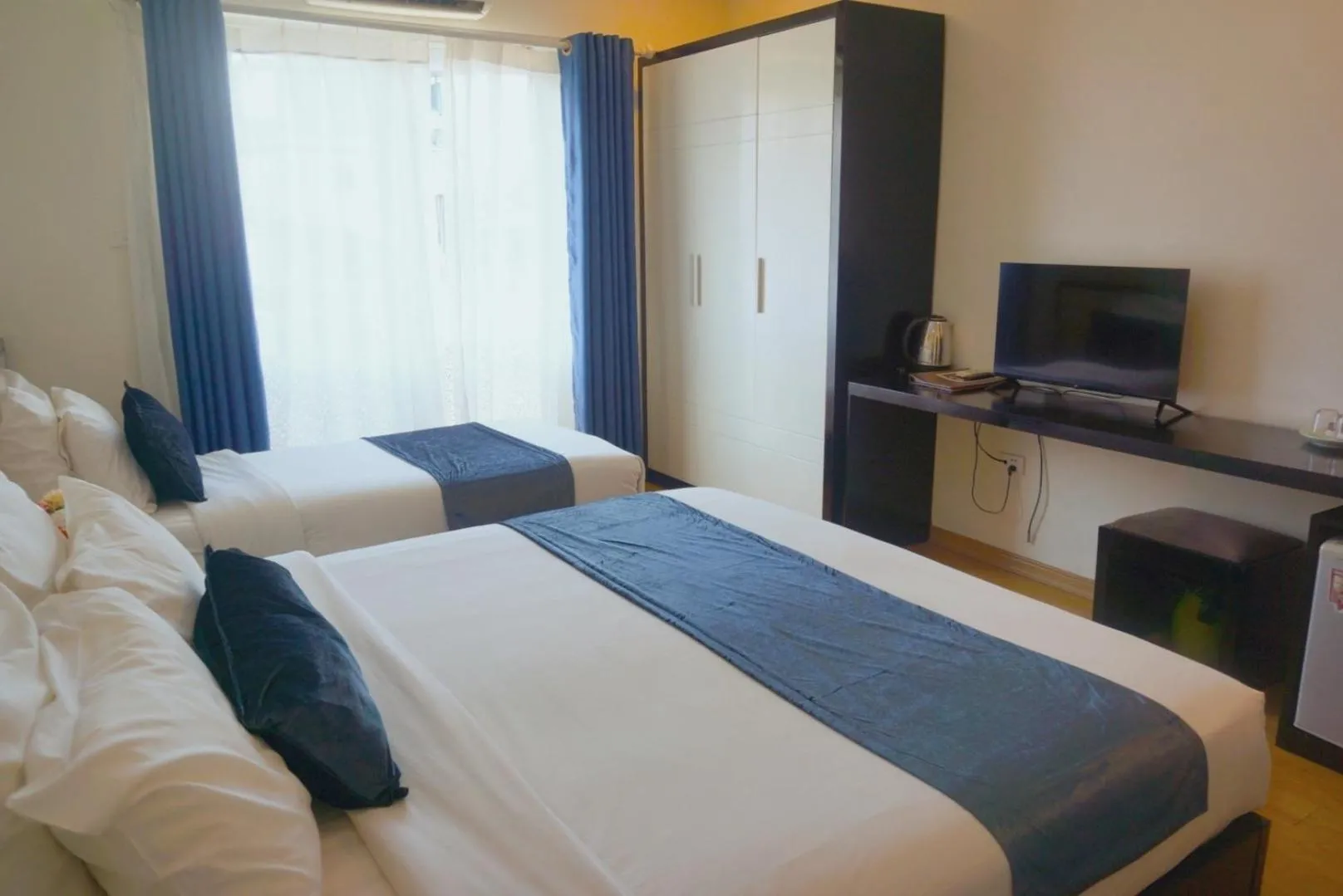 Bed in Rising Dragon Hotel