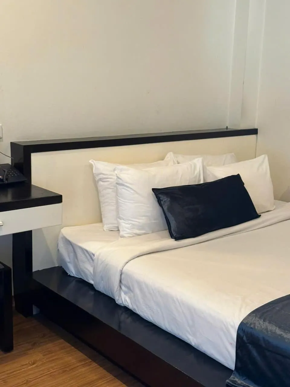 Bed in Rising Dragon Hotel