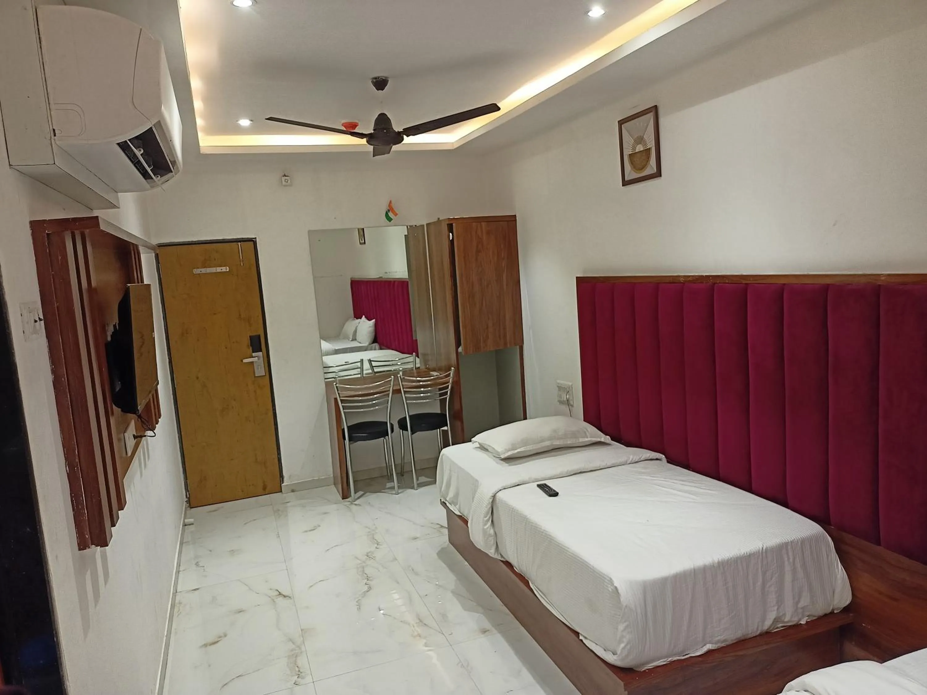 Bed in Hotel Palms Residency, Chembur Mumbai