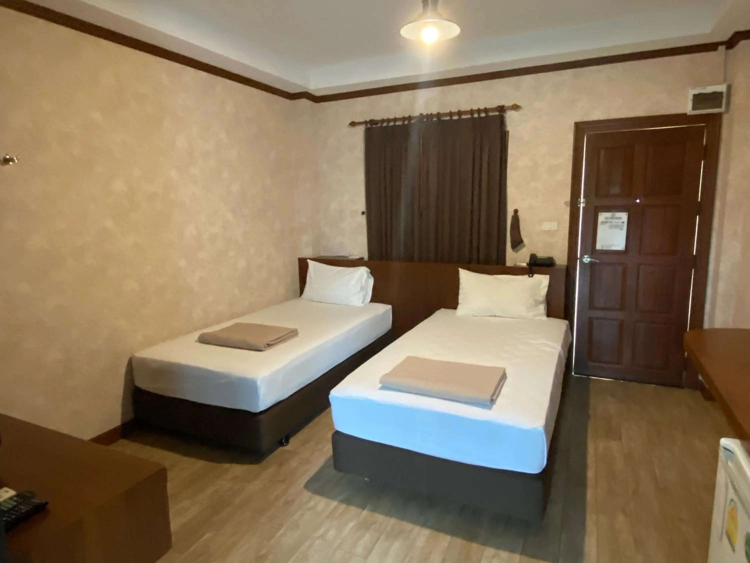 Bed in RoomQuest Chonburi Laem Chabang
