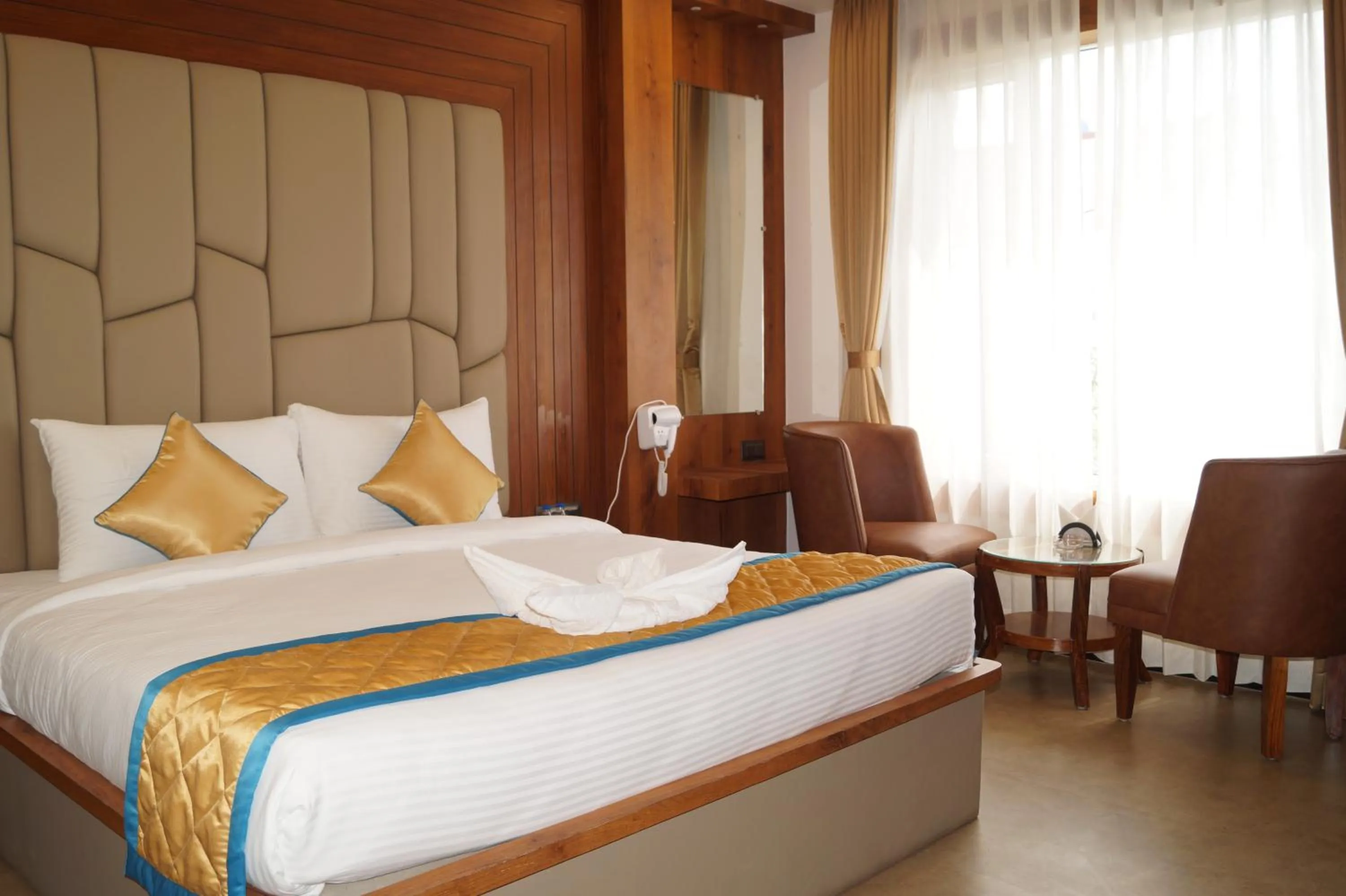 Bed in Hotel Varun Mansion Hassan