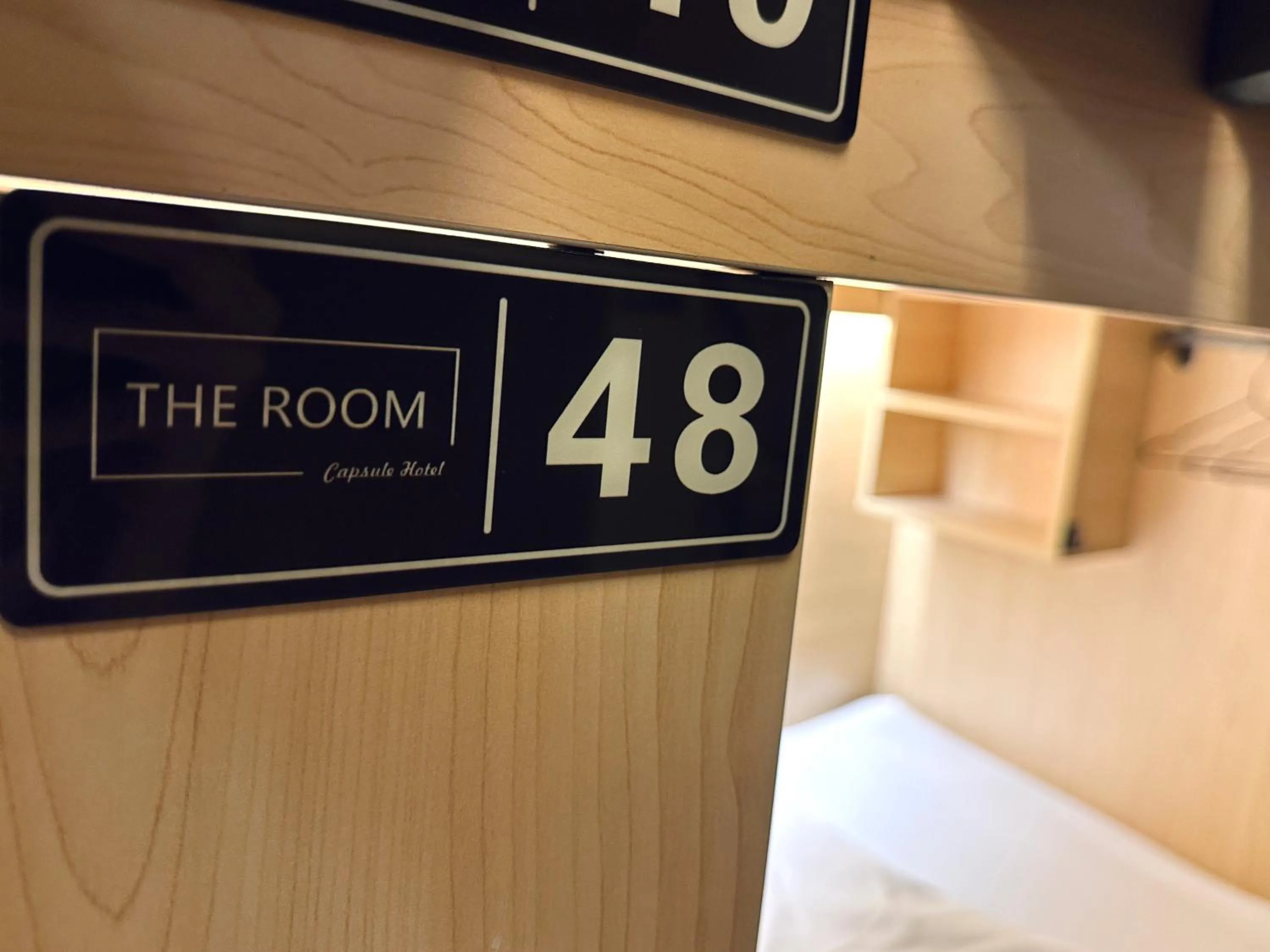 Bed in THE ROOM Capsule Hotel