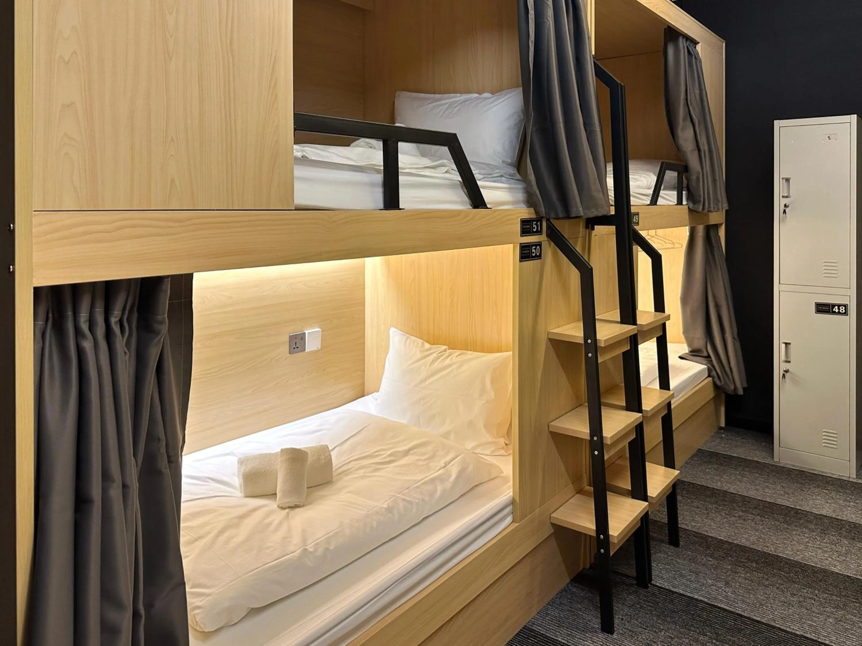 Bed in THE ROOM Capsule Hotel