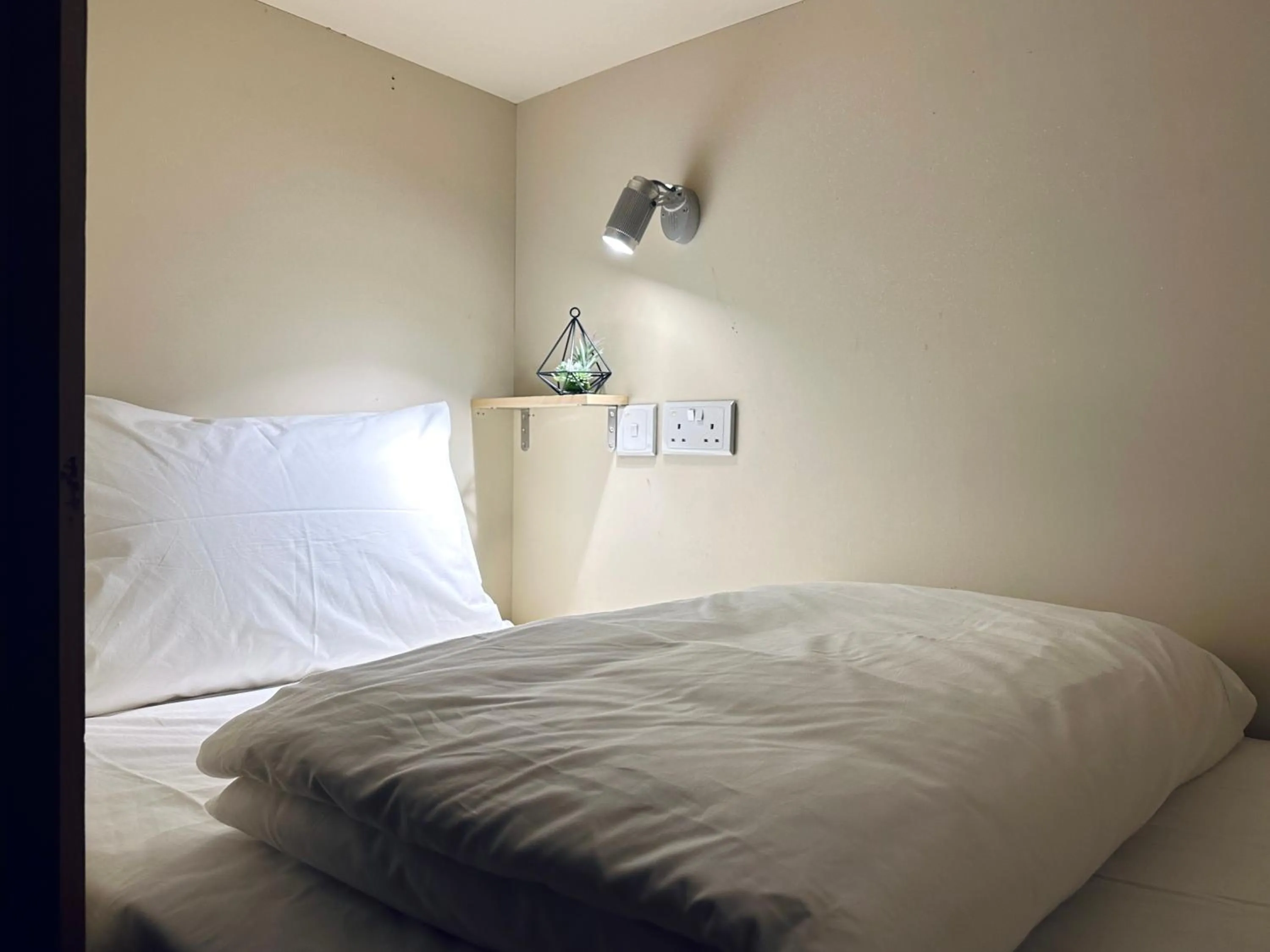 Bed in THE ROOM Capsule Hotel