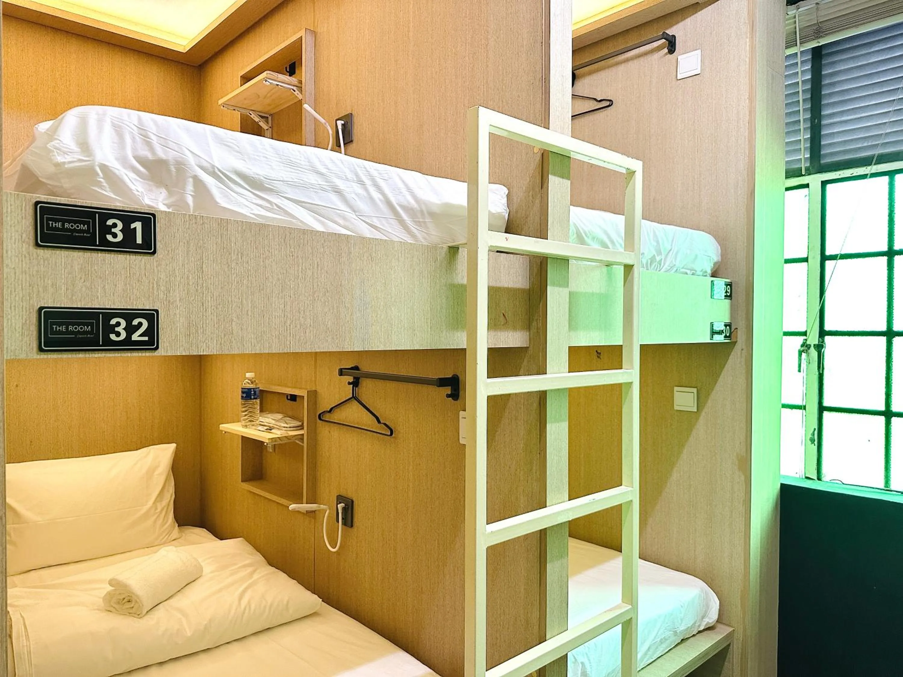 Bed in THE ROOM Capsule Hotel