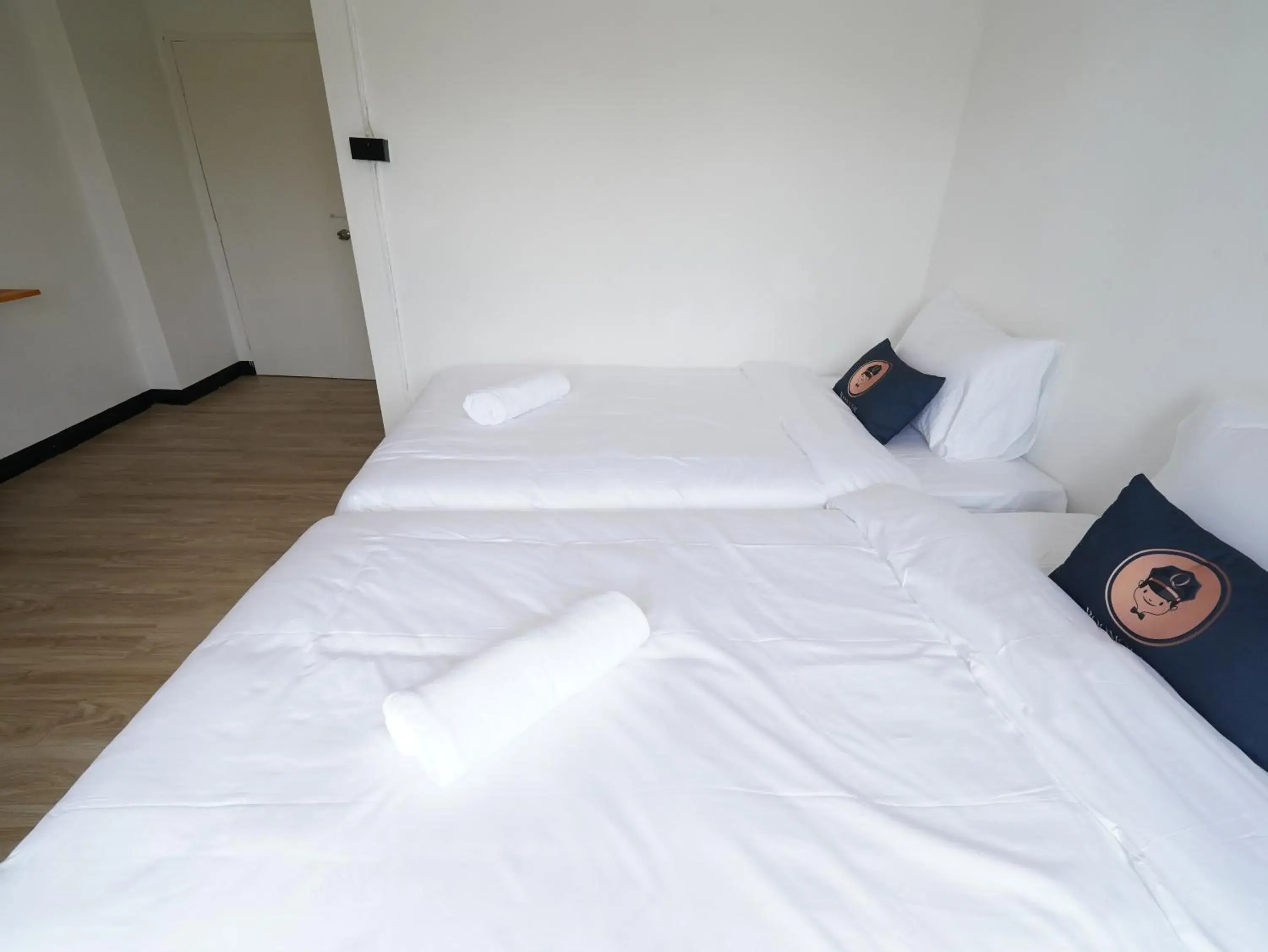 Bed in RoomQuest IT Square Don Mueang Airport Bed in RoomQuest IT Square Don Mueang Airport
