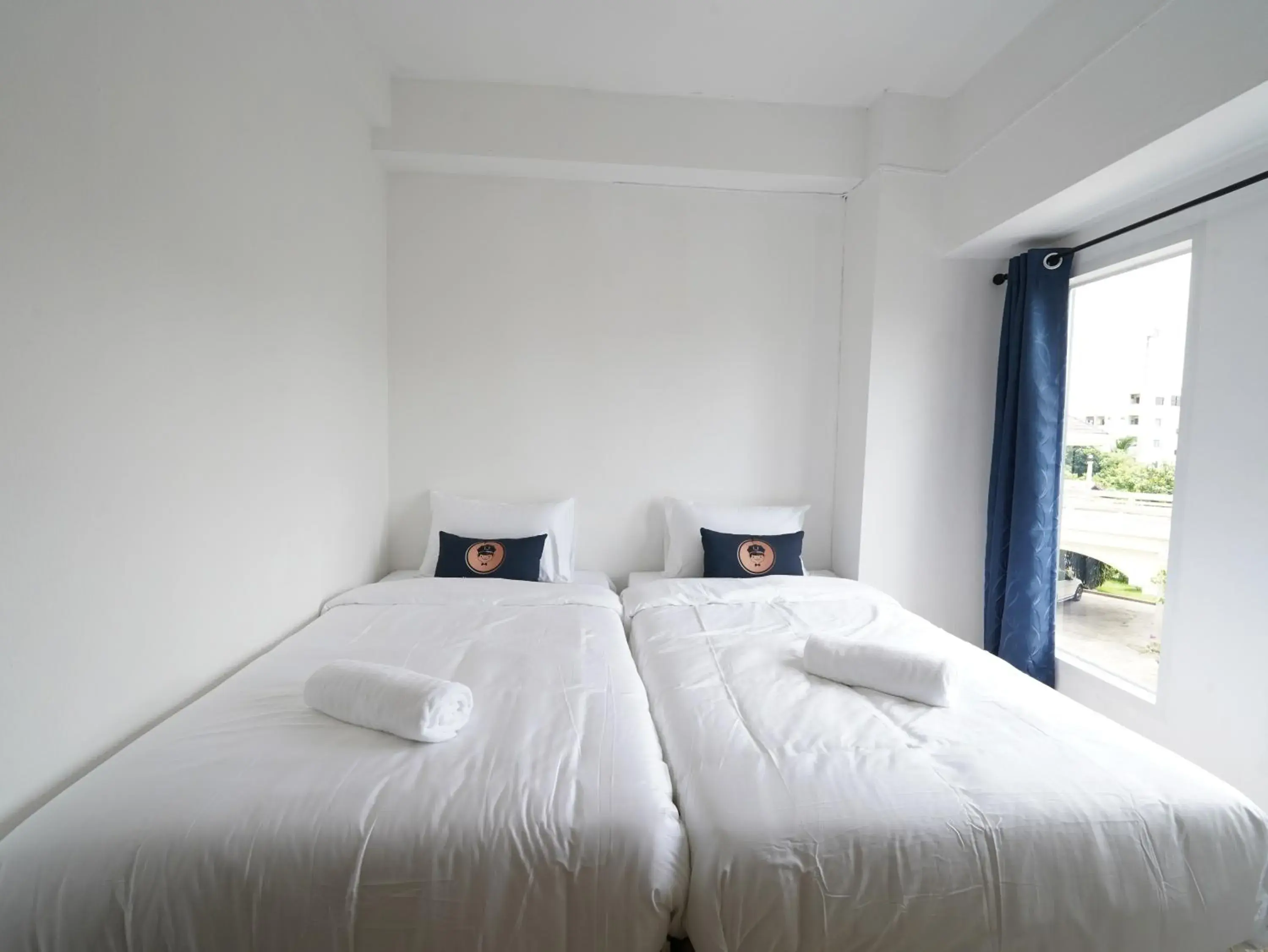 Bed in RoomQuest IT Square Don Mueang Airport Bed in RoomQuest IT Square Don Mueang Airport