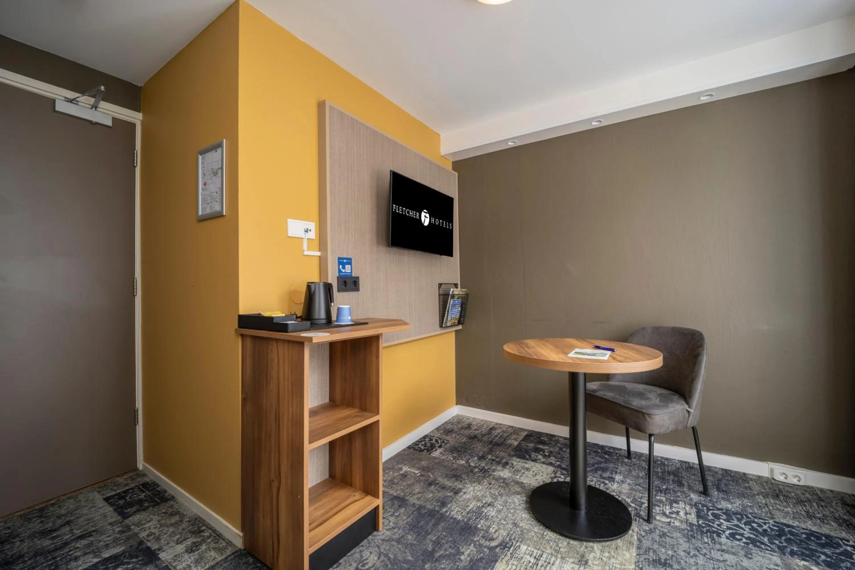 TV and multimedia in Fletcher Hotel Restaurant Erica