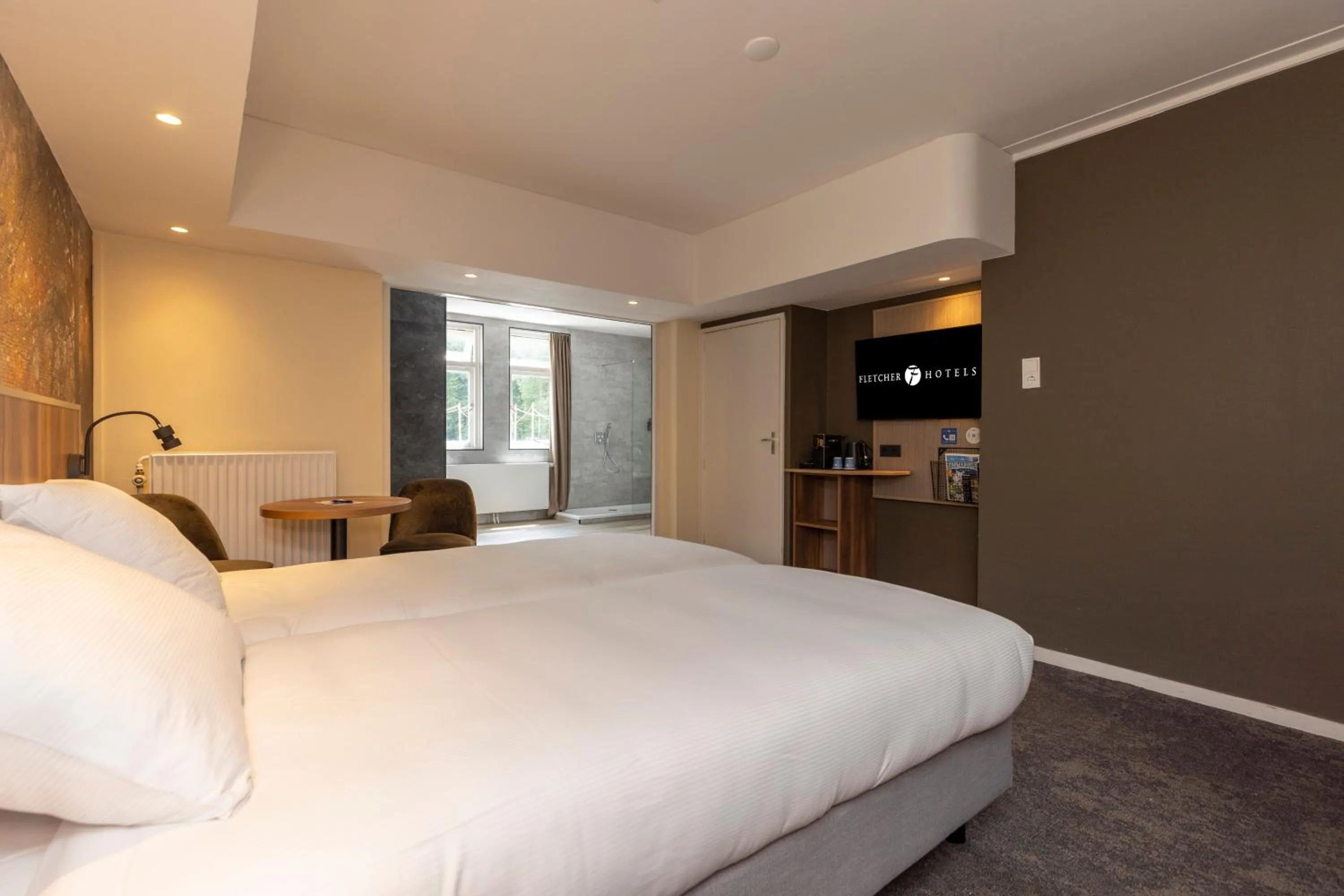 Bed in Fletcher Hotel Restaurant Erica