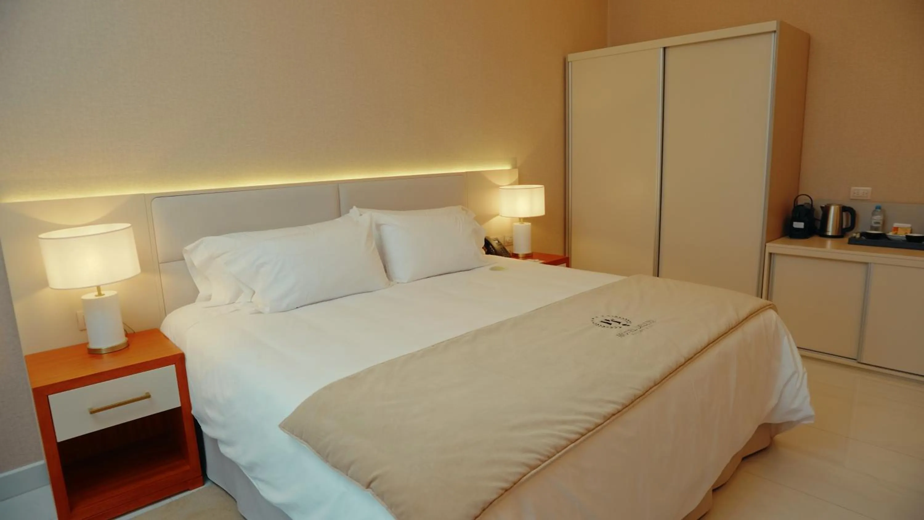 Bedroom in HT Hotel Deluxe Resort & SPA