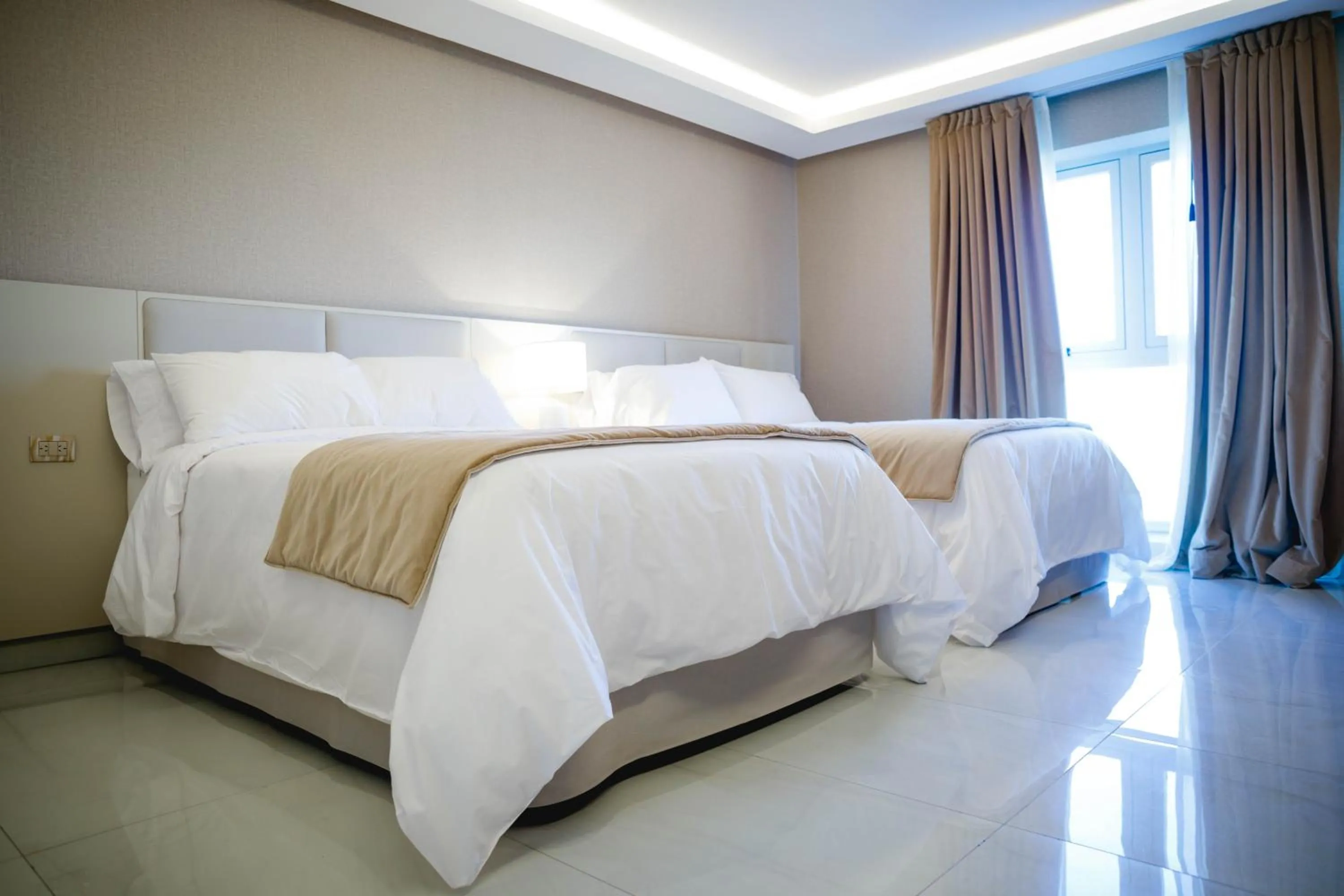 Bed in HT Hotel Deluxe Resort & SPA