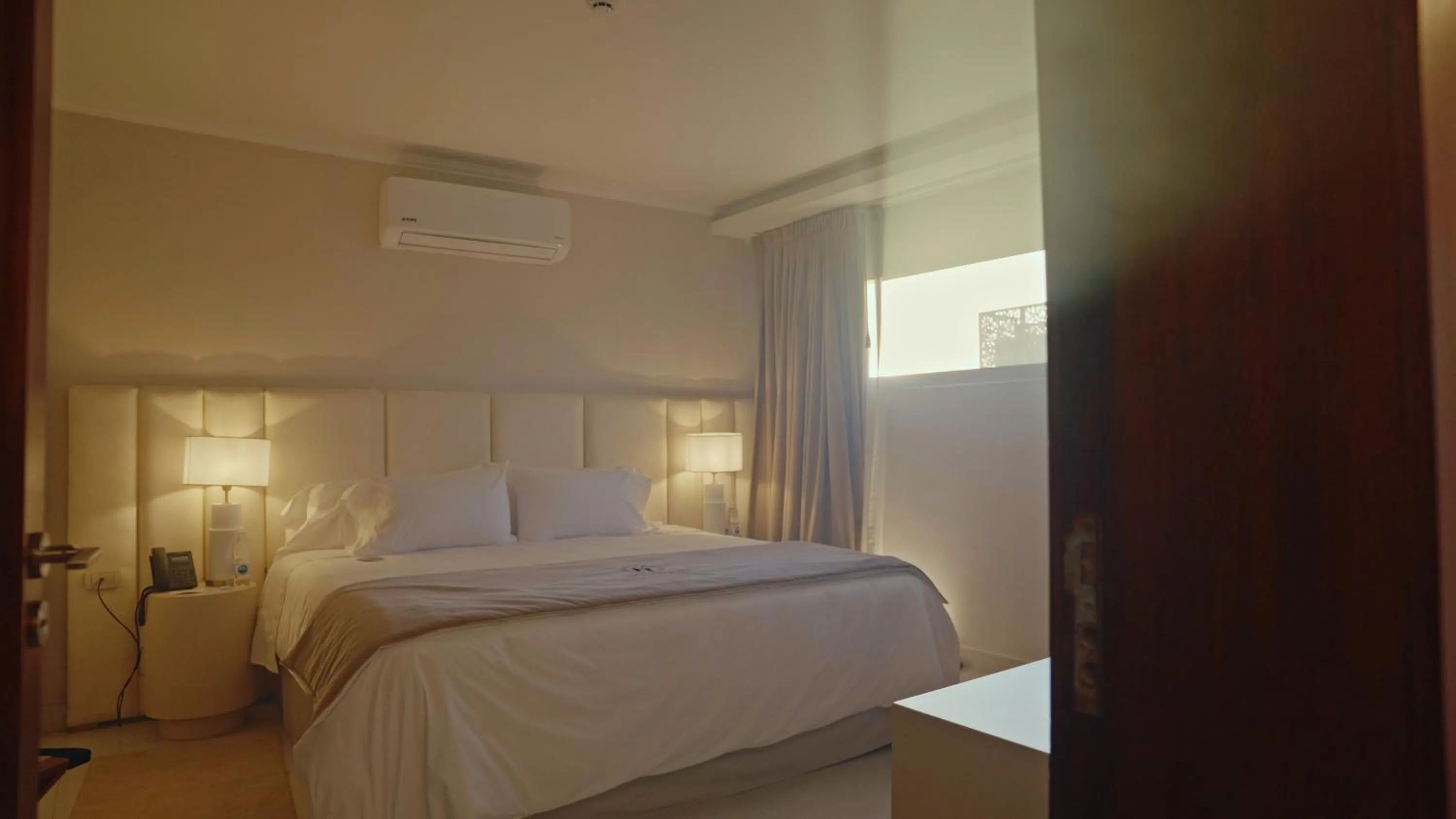 Bed in HT Hotel Deluxe Resort & SPA