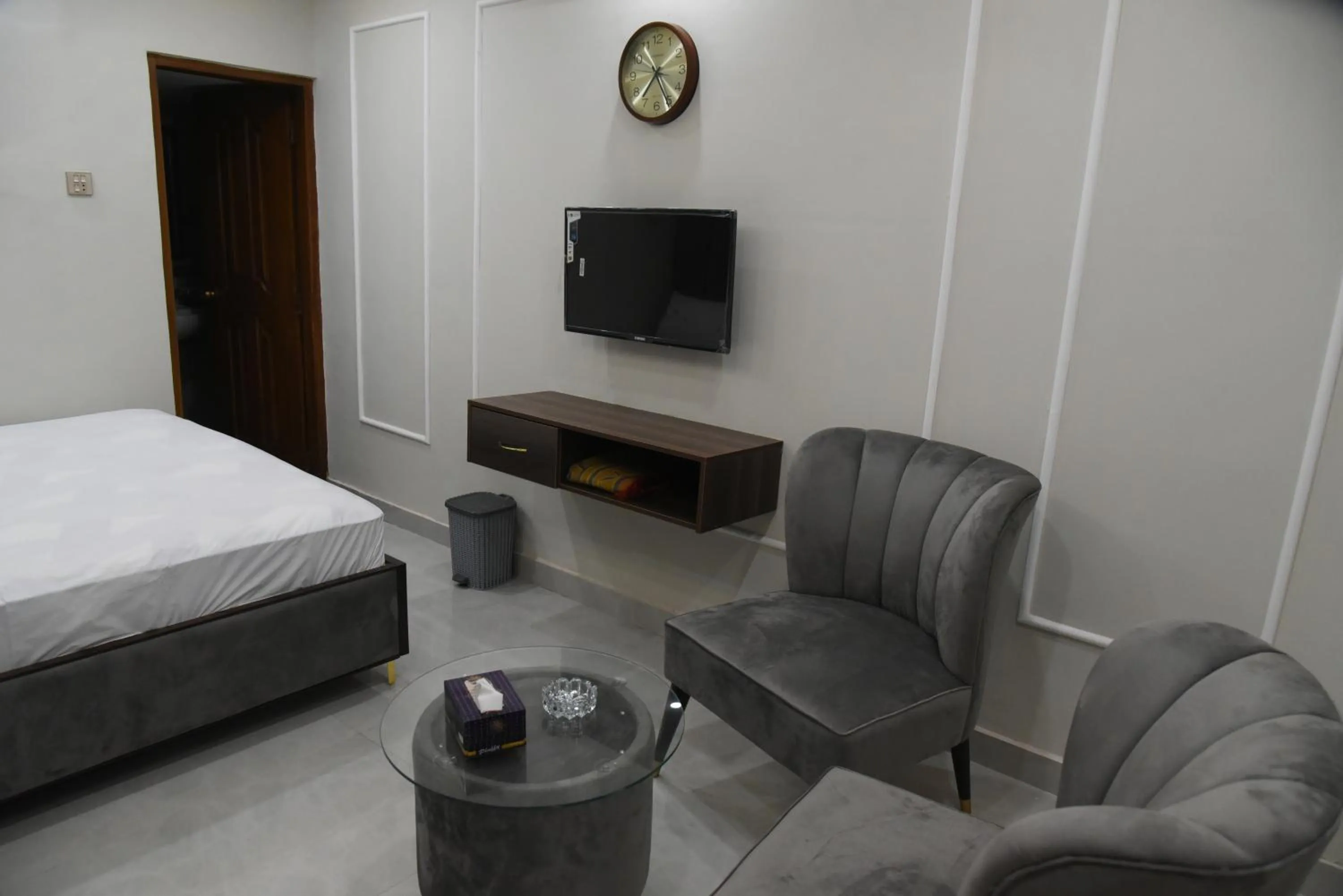 Seating area, Bed in Hotel white season Gulberg