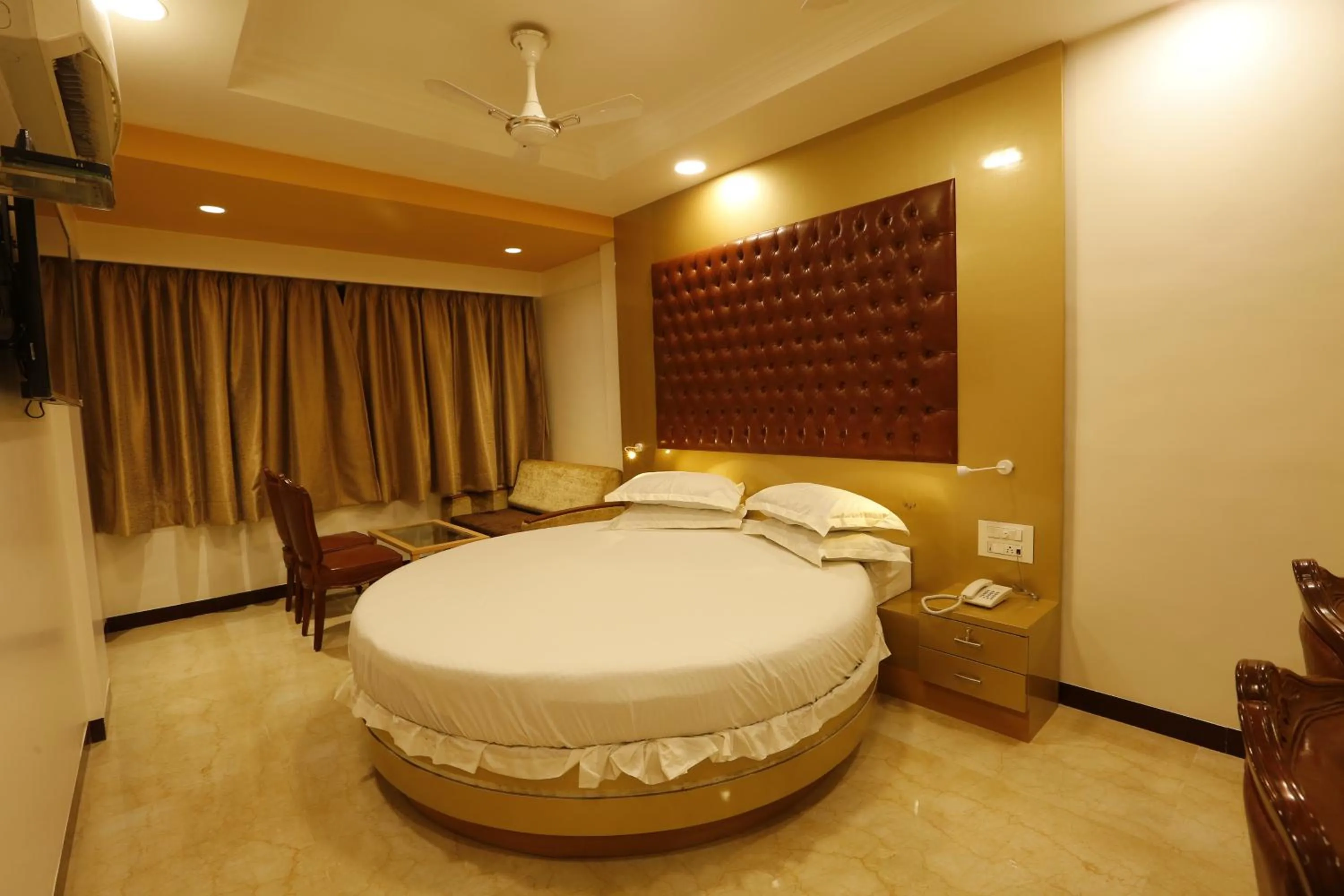 Bed in Hotel Ravikiran Alibaug