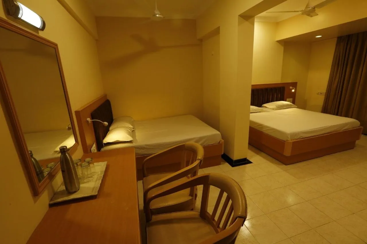 Bed in Hotel Ravikiran Alibaug