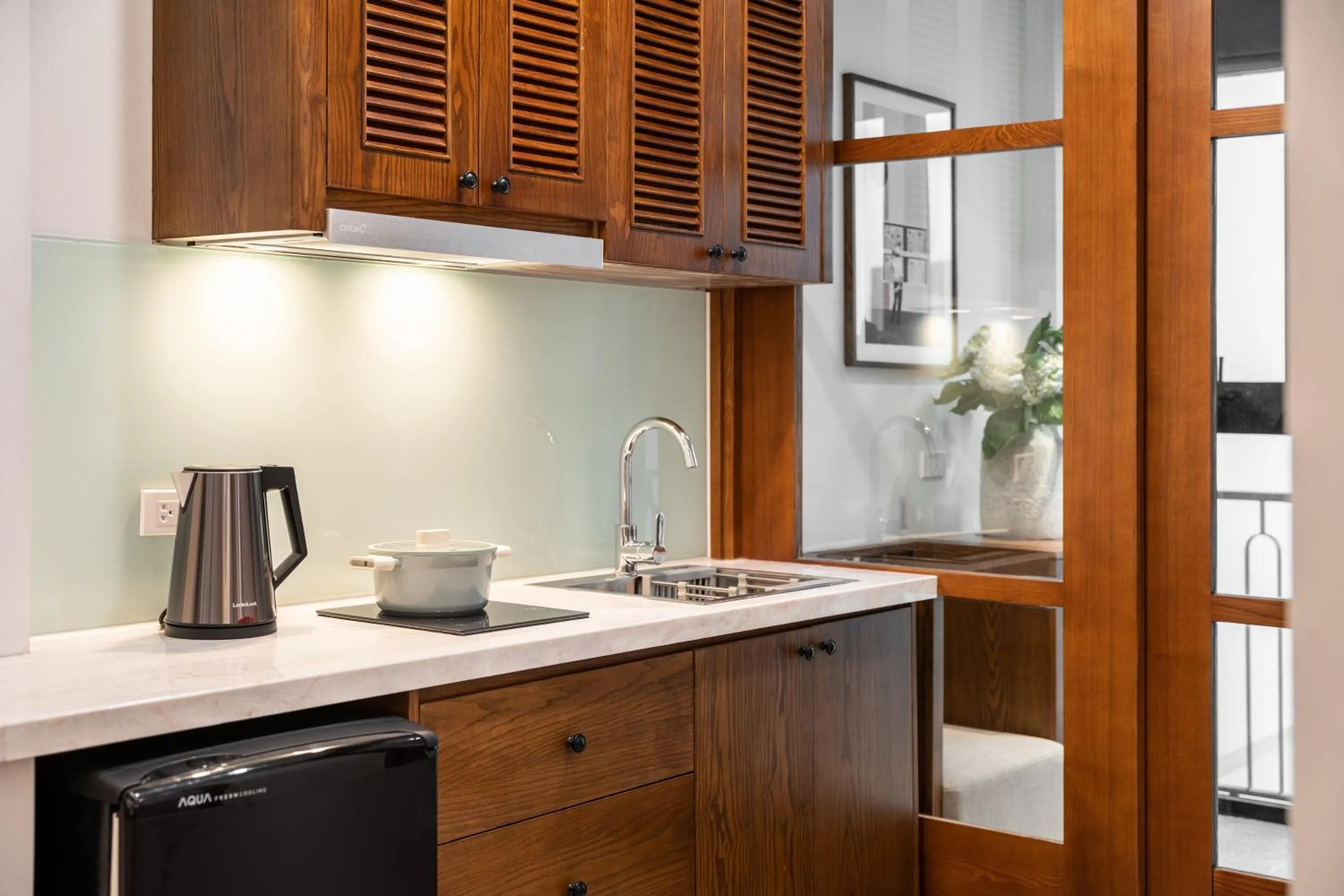 Kitchen or kitchenette in Le Parfum Apartment and Hotel